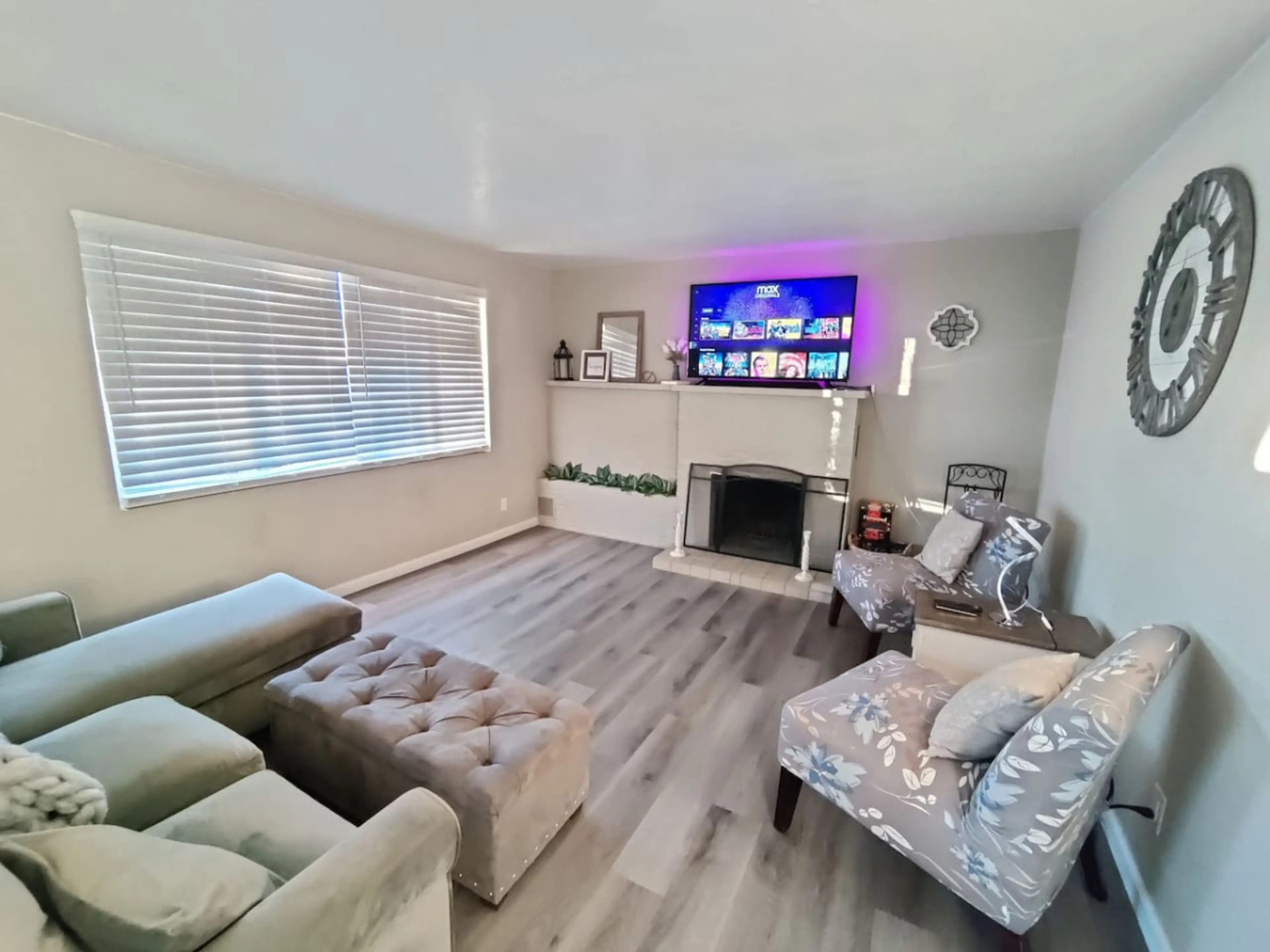 Comfortable living room with a wood fire place to keep you nice and cozy.