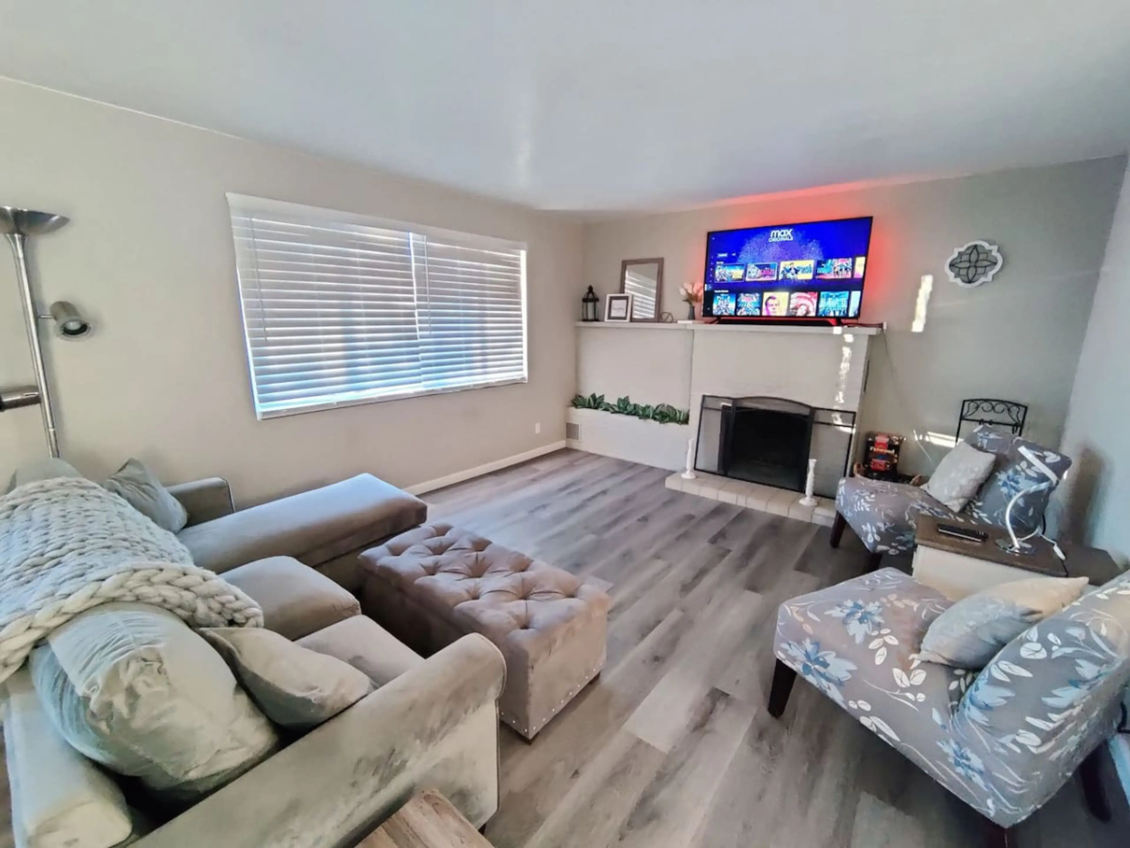 Comfortable living room space with a cozy real wood fireplace.