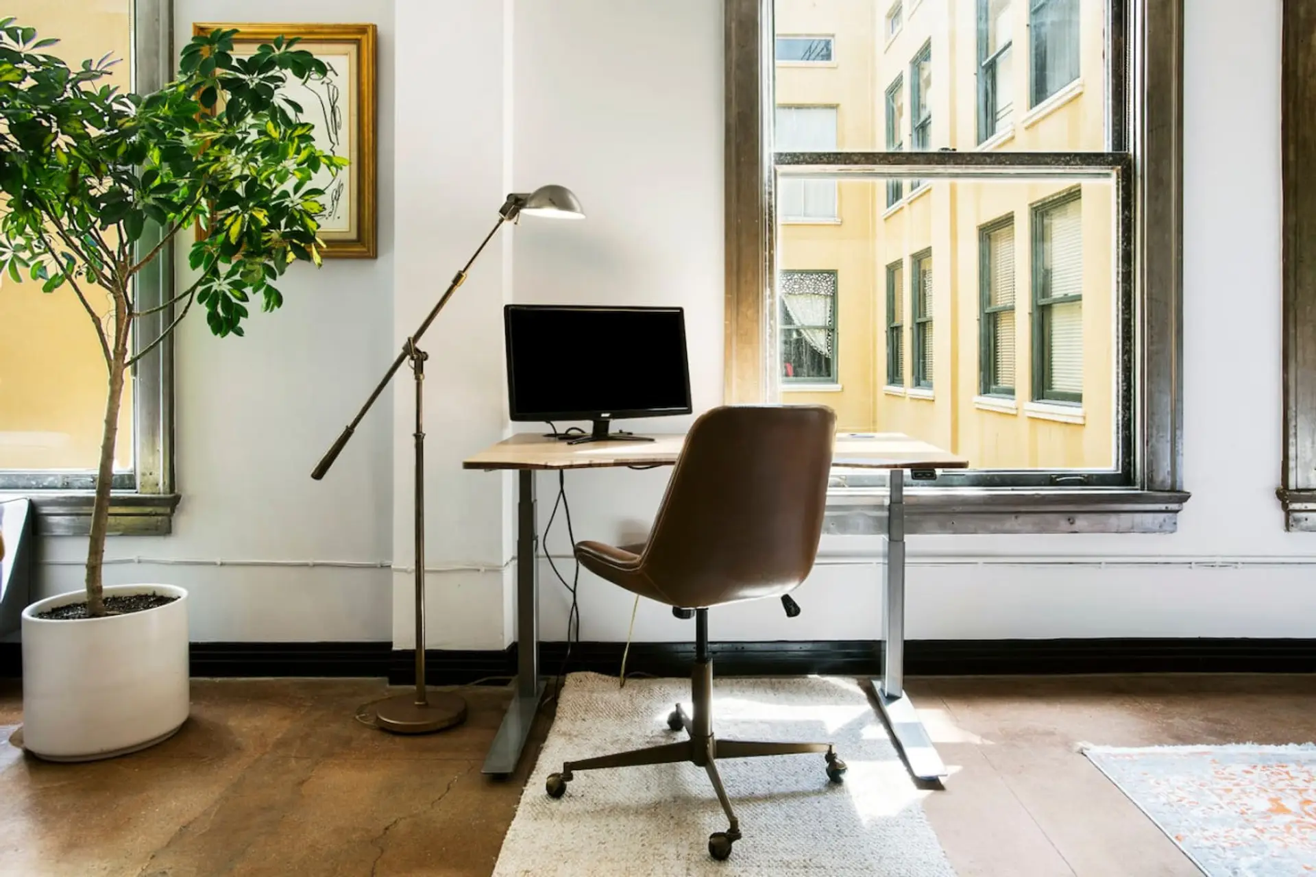 Work from anywhere with ease in this comfortable setup, featuring a monitor and high-speed WiFi.