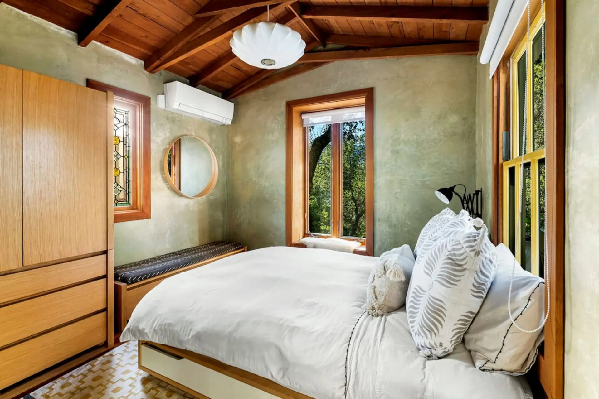 Serene & Stylish Retreat – A well-designed primary room with a comfortable queen bed and a spacious wardrobe.