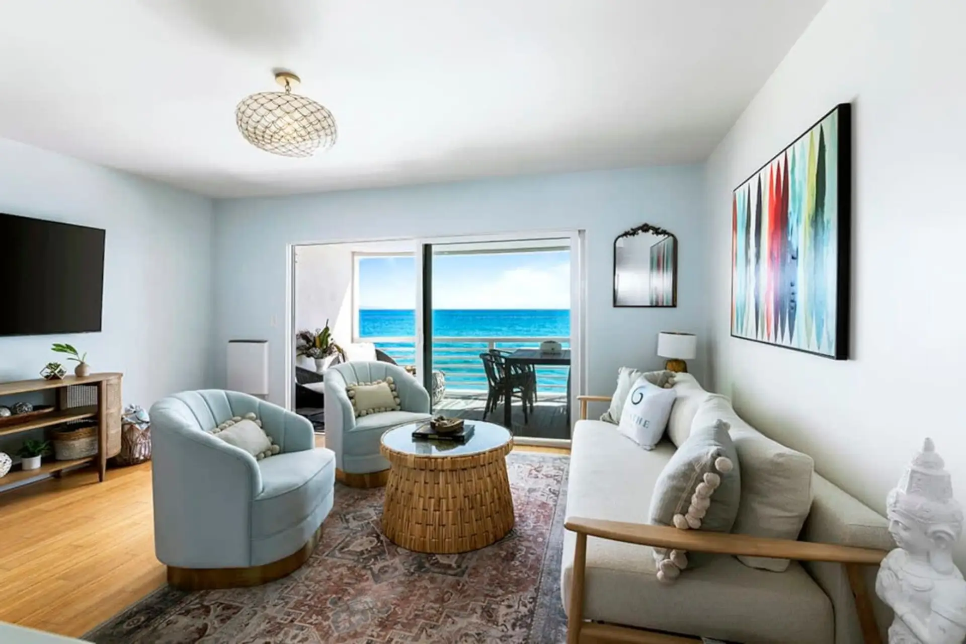 Step into a luxurious living area haven, complete with a balcony offering ocean breezes and breathtaking views—perfect for the ultimate vacation escape.