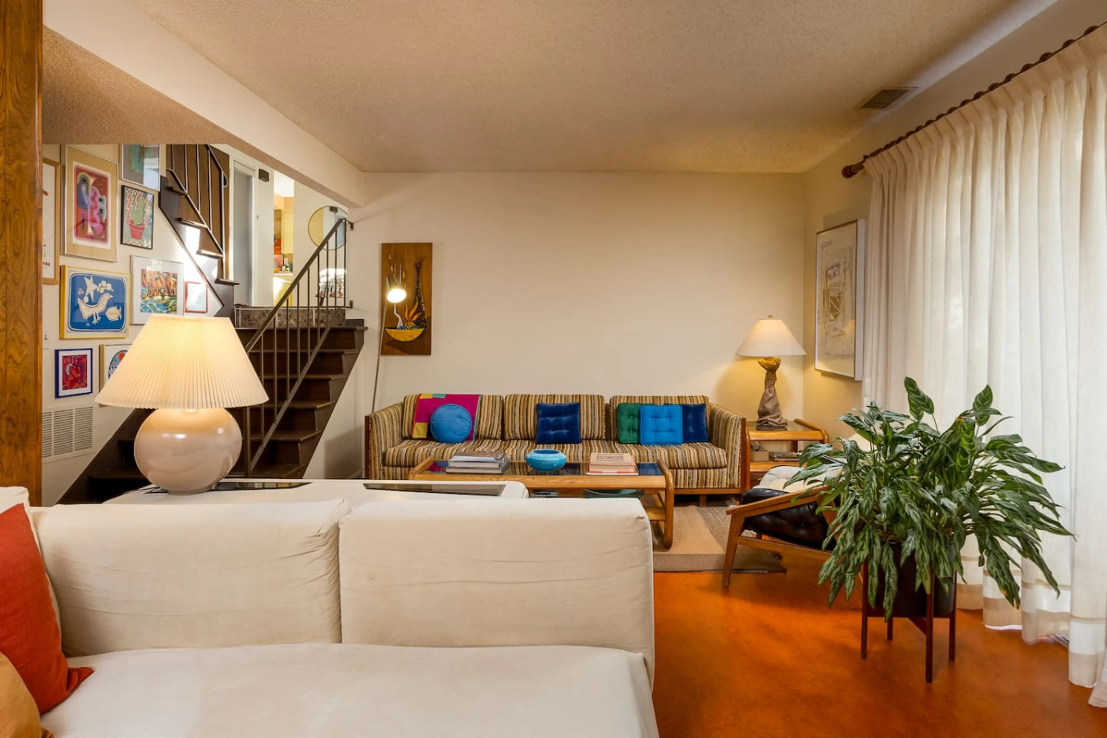 Sink into the cozy sofa and enjoy a relaxing, home-like space filled with sunlight, gentle breezes, and calming nature views.