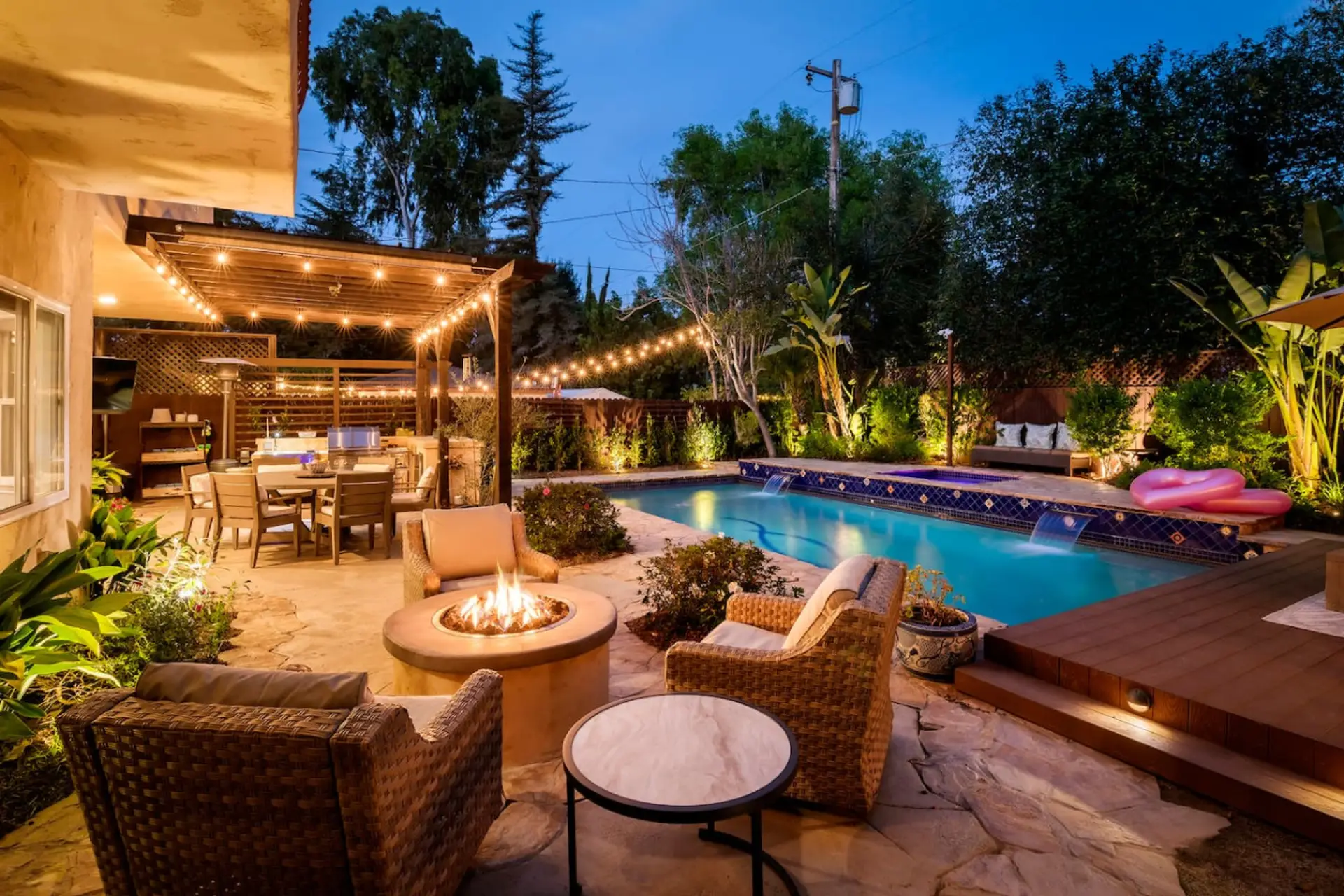 Unwind by the pool under warm string lights and open skies.