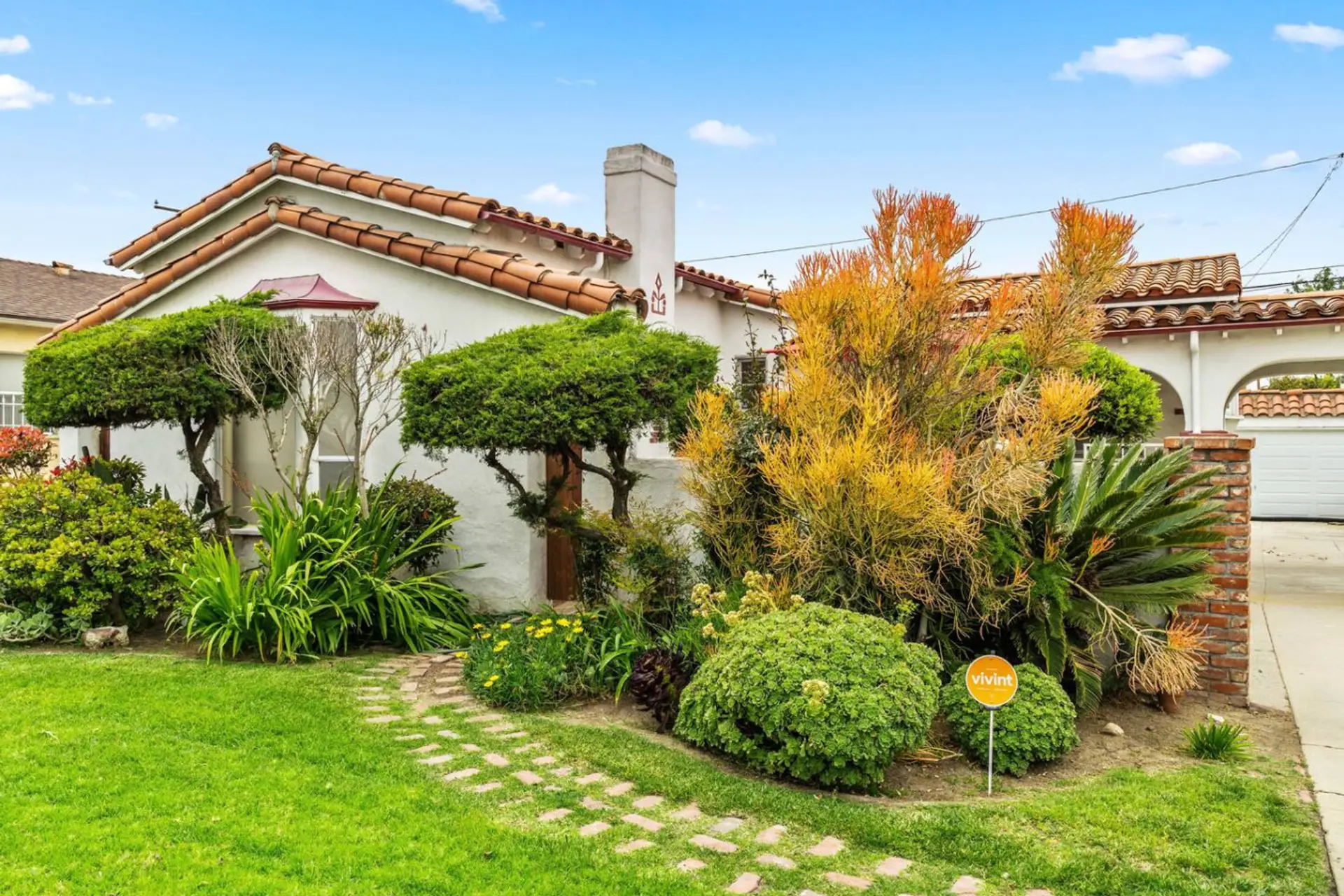 Charming Spanish-style home on a peaceful, tree-lined street.