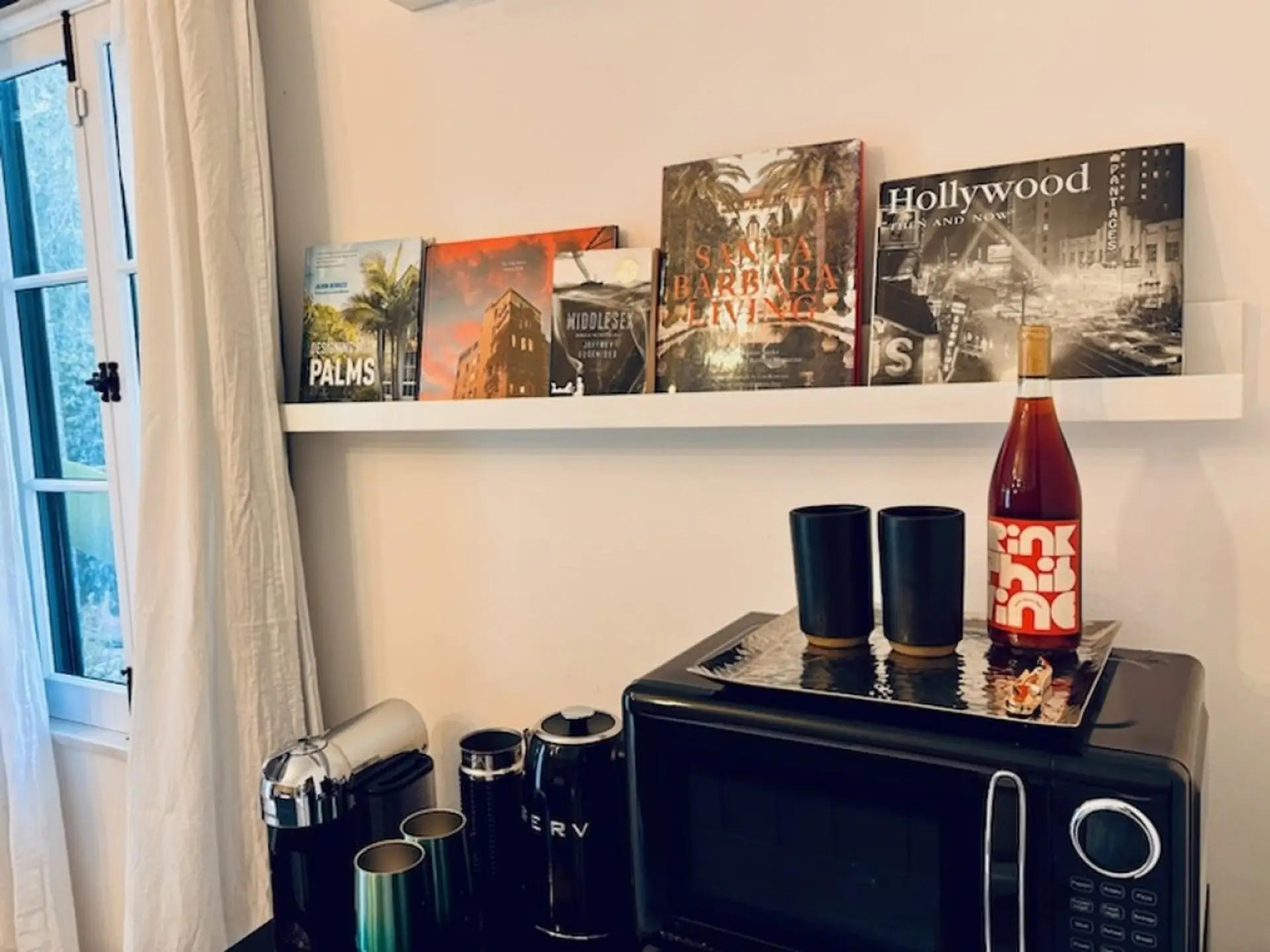 A curated shelf of coffee-table reads, perfect for a quiet evening in.