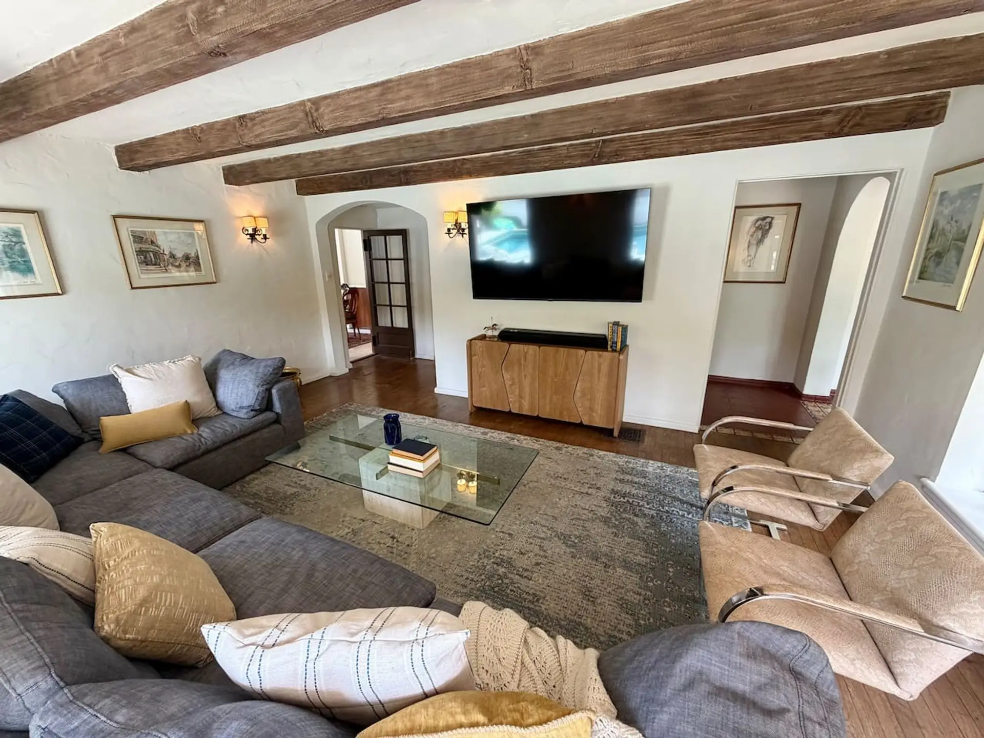 Beamed ceilings and a sectional built for gathering