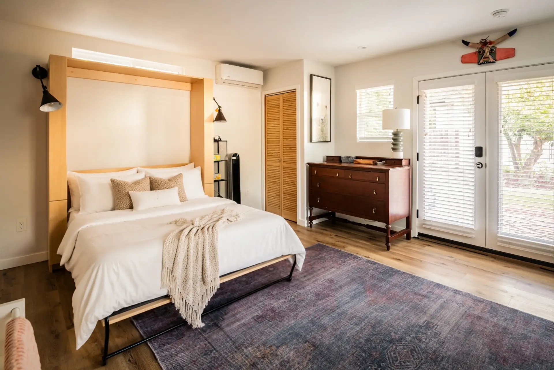 Sun-drenched bedroom retreat with French doors to the garden
