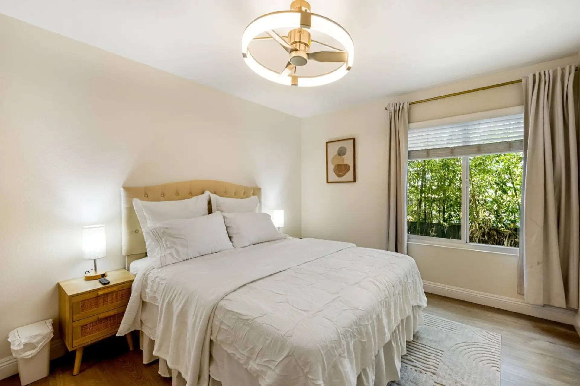 A private, quiet retreat with a queen bed, walk-in closet, and ceiling fan.