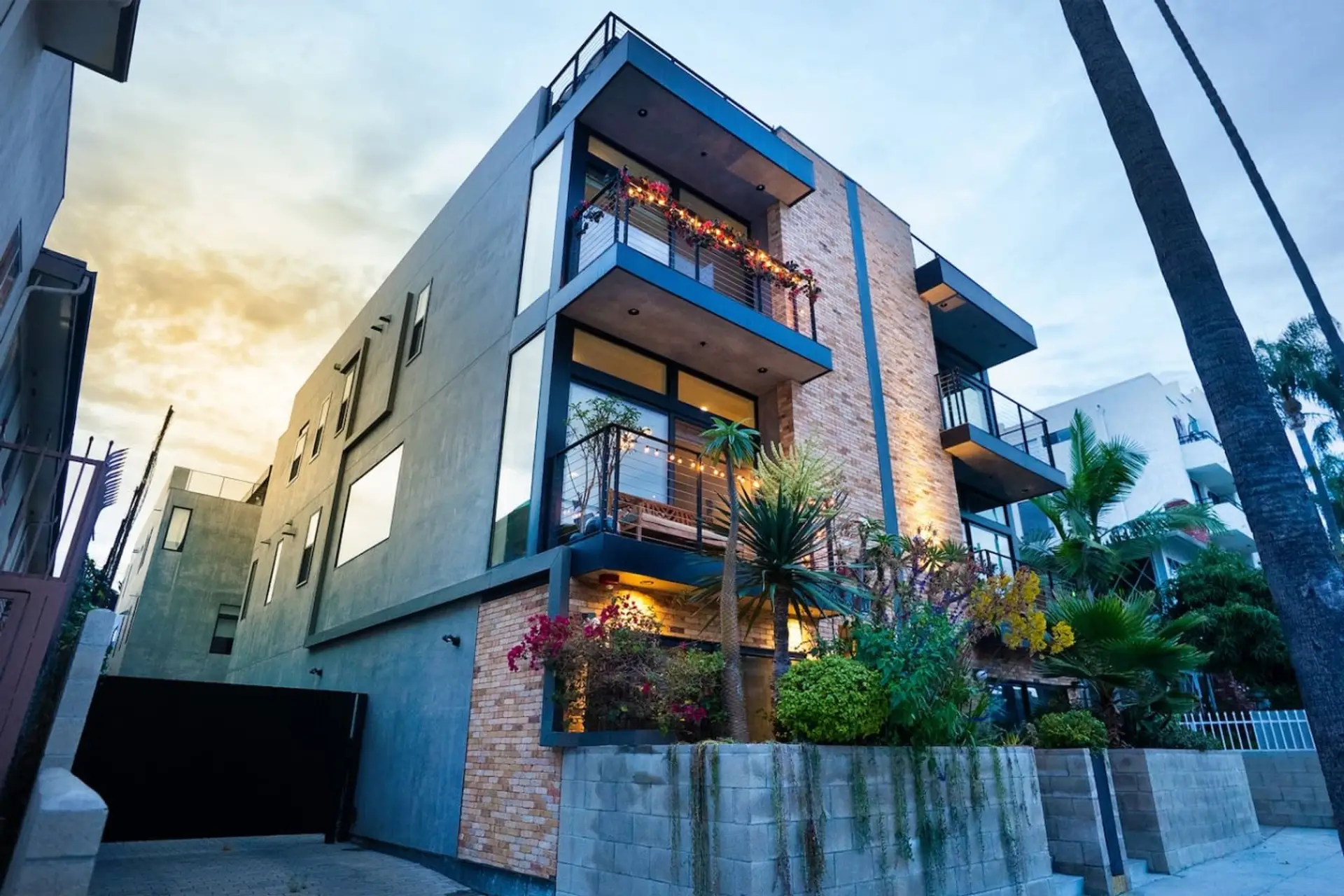 Modern townhome · Private entrance · Attached garage · Four-story home · Front garden · Balconies · Rooftop lounge · Full home sound system · Ring Alarm System