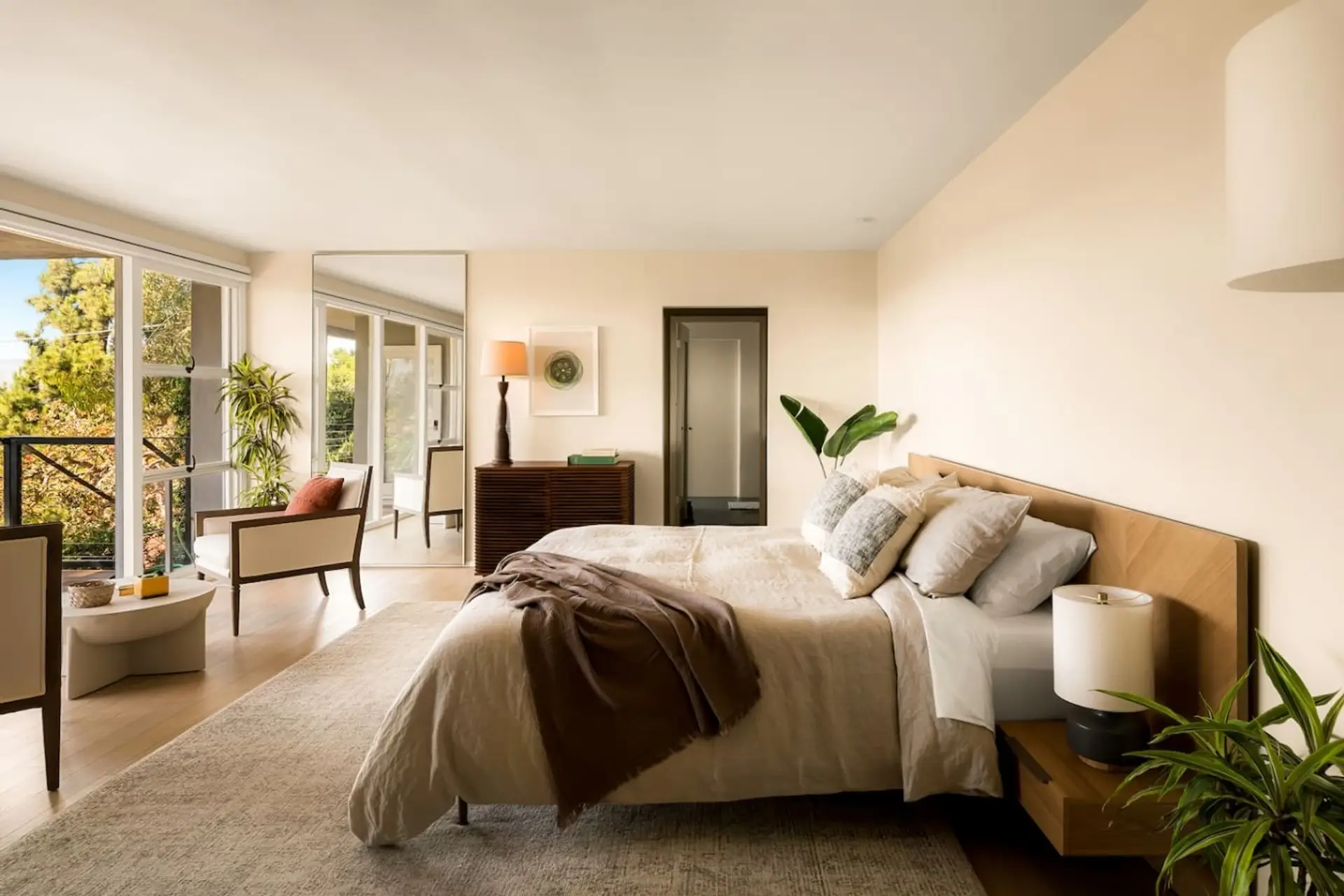 Boutique-hotel-style primary suite with a king bed and a calm, airy feel