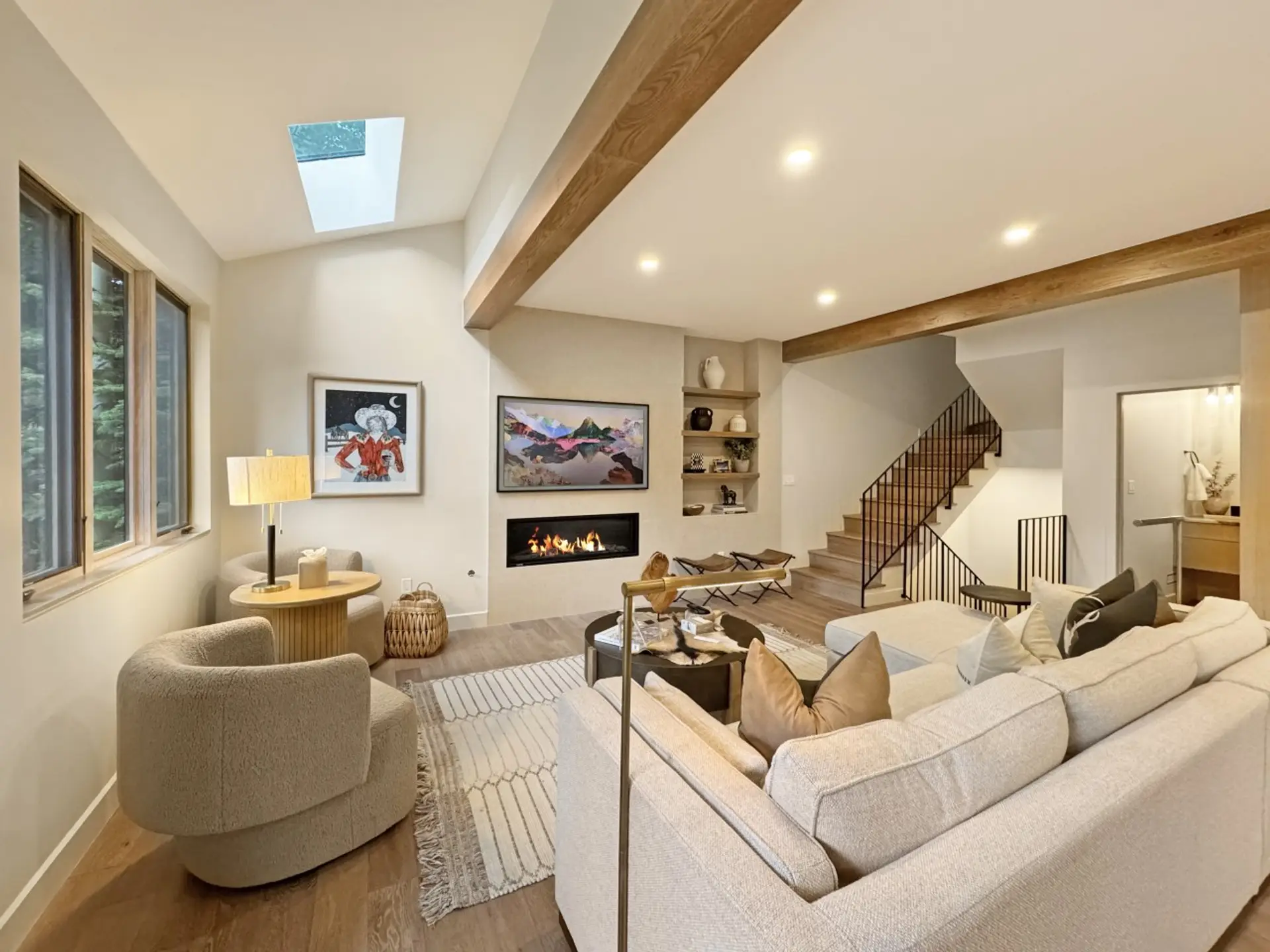 Movie night by the fireplace, smart TV ready to go, stairs leading up to the sleeping levels. Everything you need to unwind after a day in Vail.