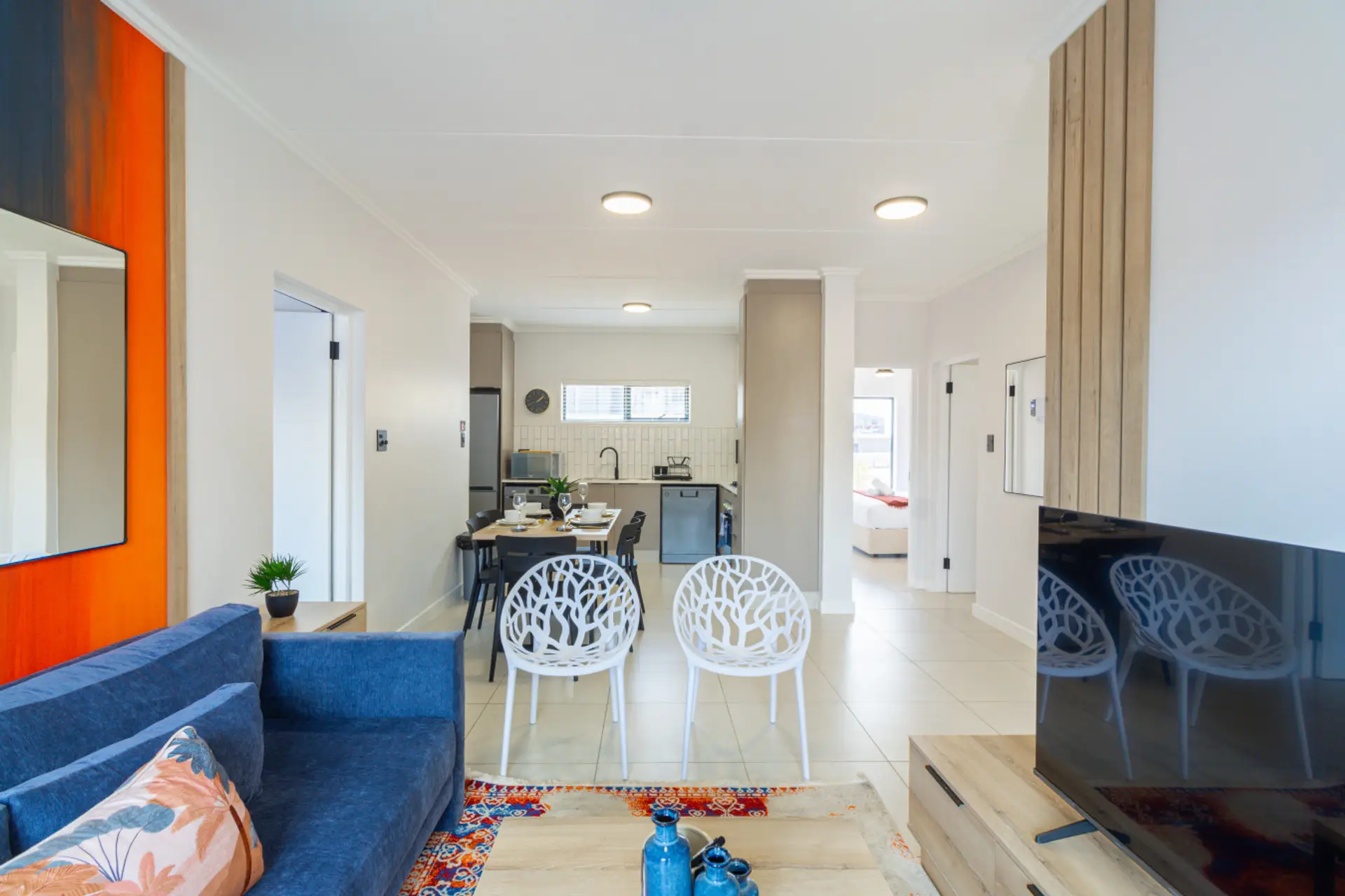 Open-plan living, dining and kitchen area leading out to the garden