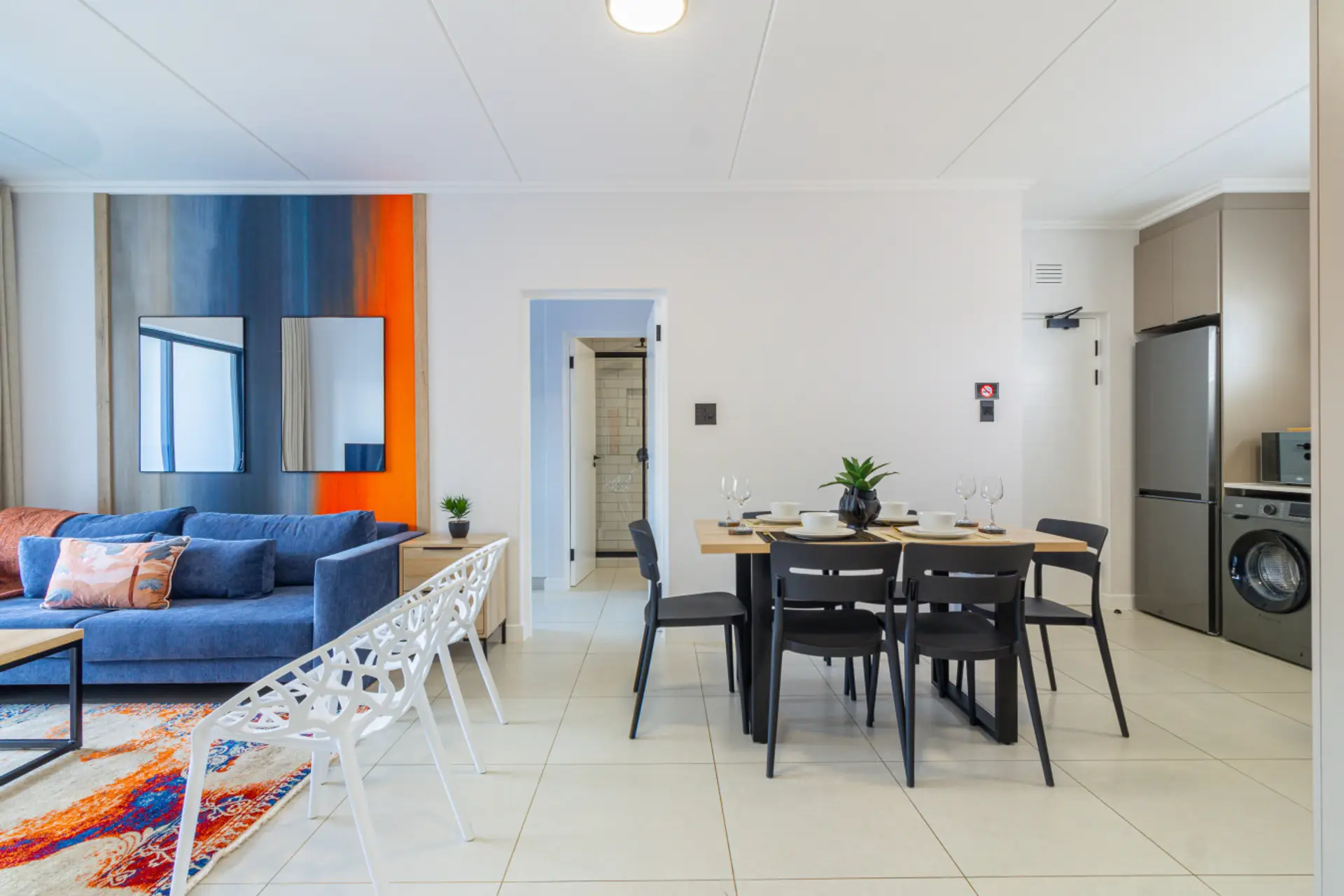 Open-plan living, dining and kitchen area leading out to the garden