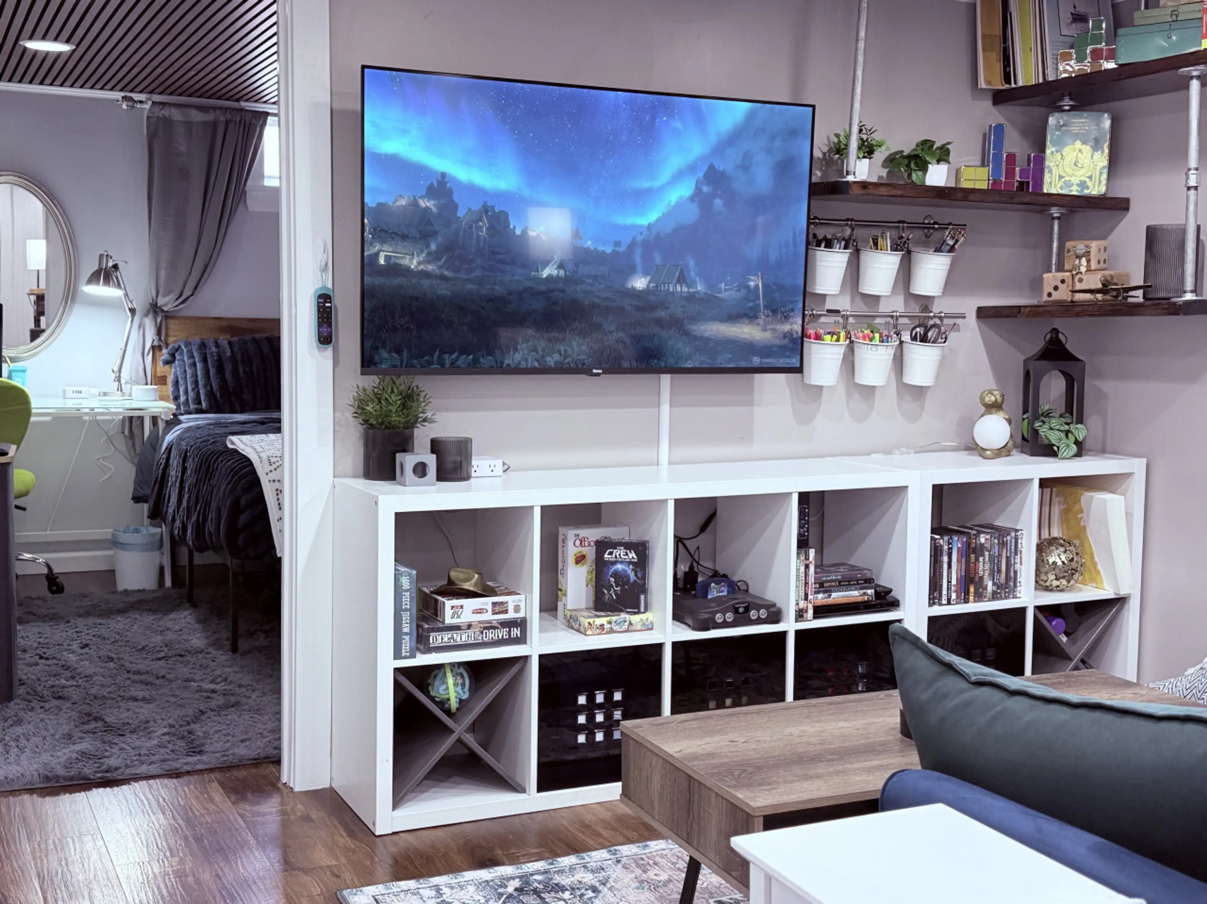 Living room includes an N64, DVD player, books, puzzles, and some toys.