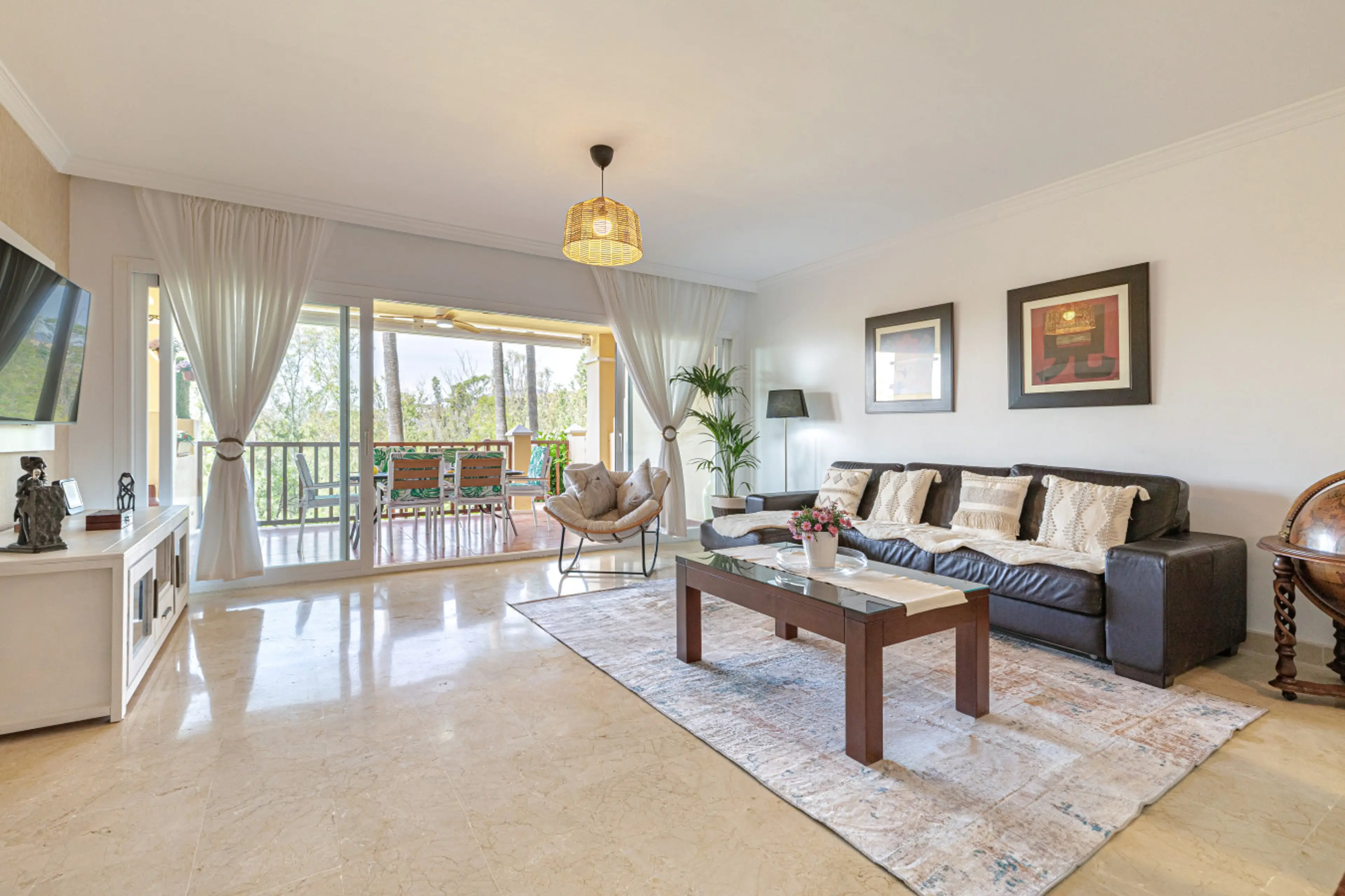 Spacious & Bright Living Area: Light-filled, open-plan living room with large Smart TV and plenty of comfortable seating.