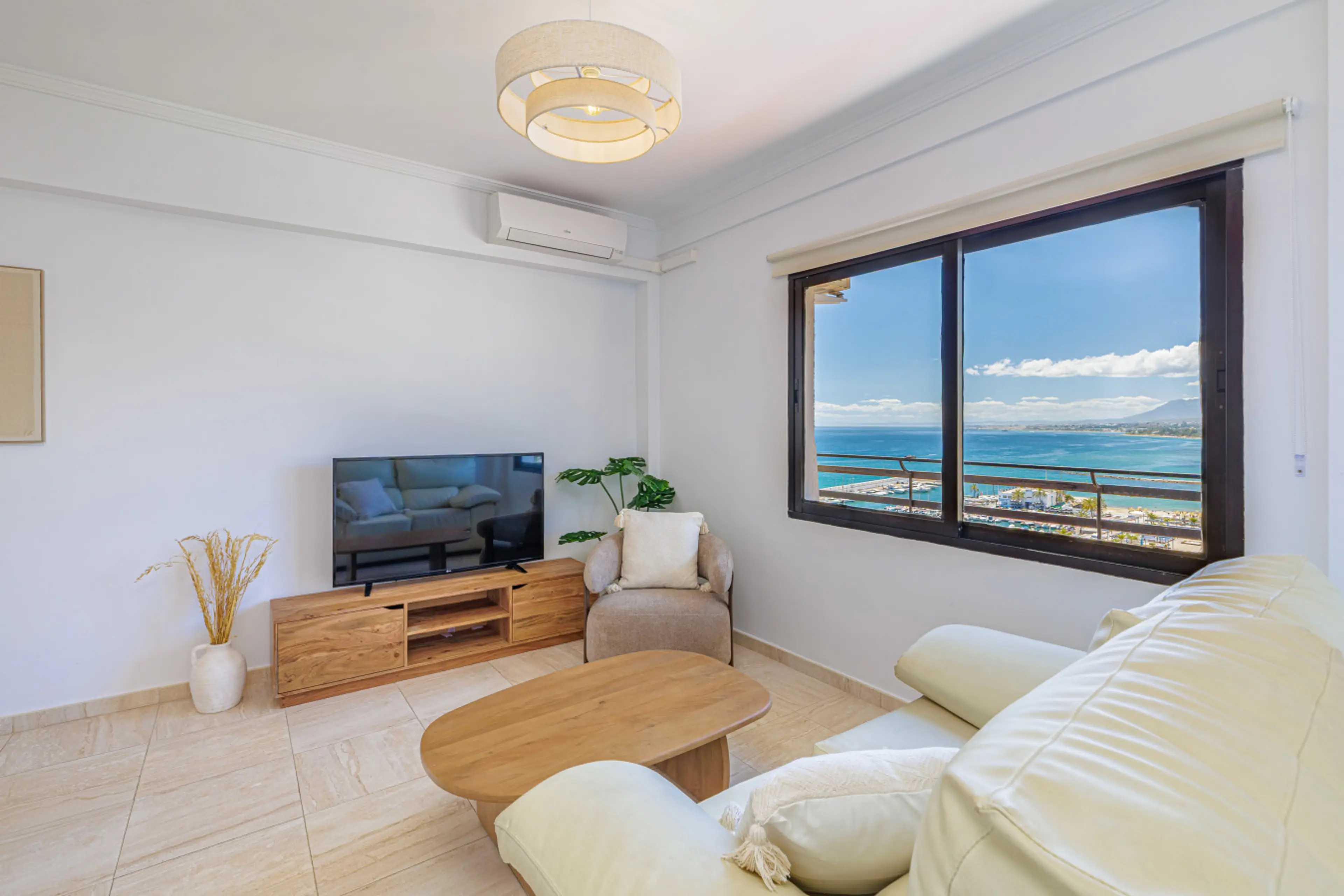 Relax in the air-conditioned living room with stunning beachfront views right from the sofa.