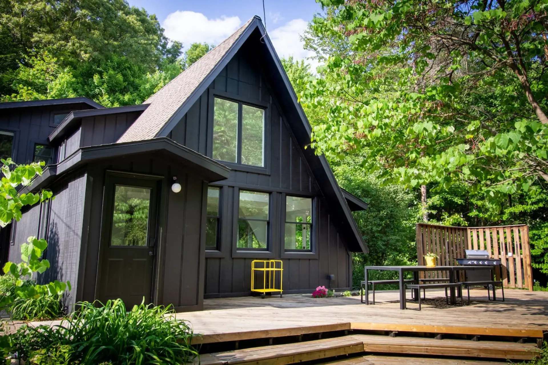 Chillin' on the deck with nature's finest views 🌳✨ This cozy home is all about that perfect outdoor vibe. Who's ready to kick back and relax in this slice of paradise? 🏡🌿 #OutdoorLiving #HomeGoals