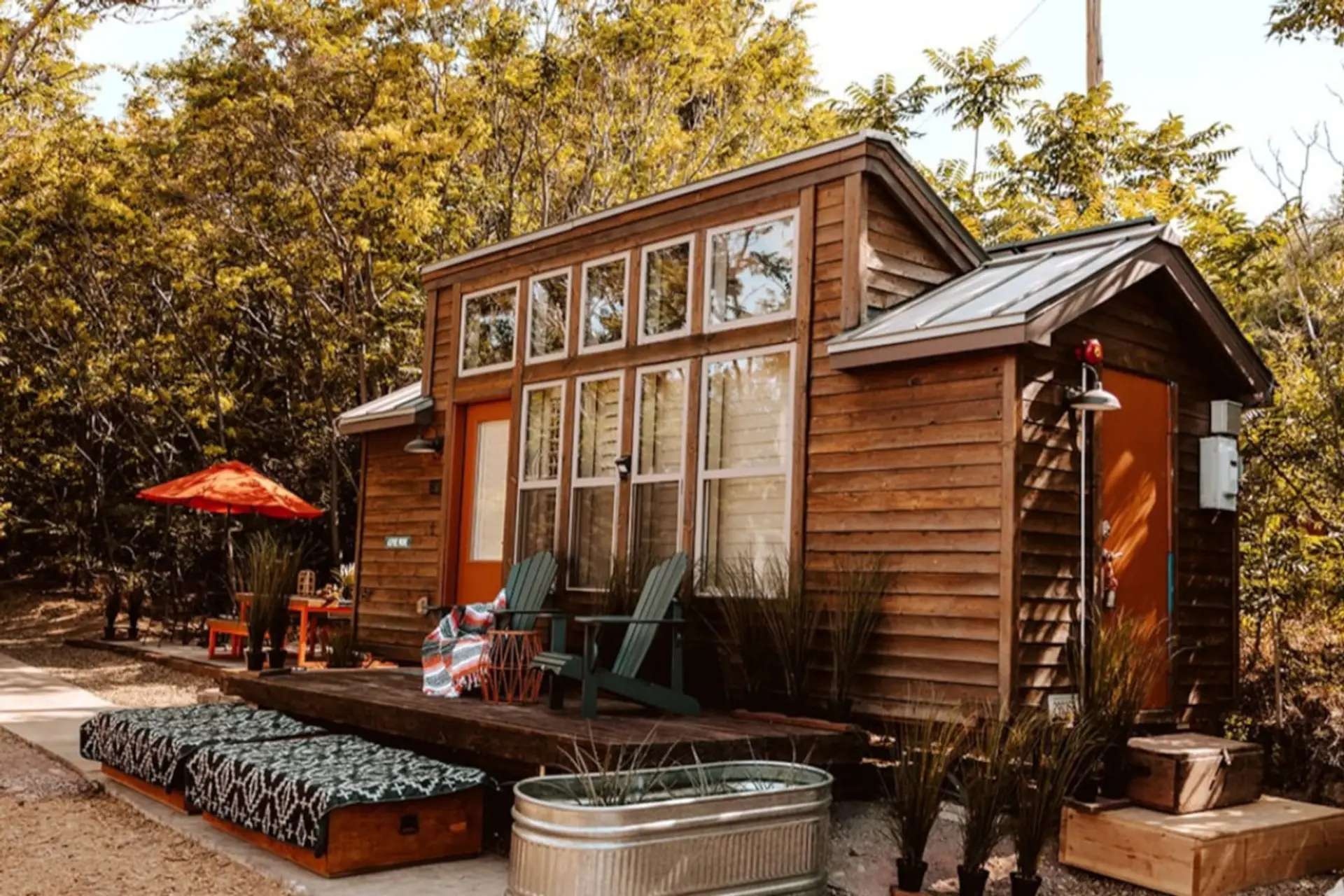 Your private tiny home offers a spacious outdoor deck surrounded by mature trees, creating a peaceful setting to relax after hiking, wine tasting, or exploring Old Town Cottonwood.