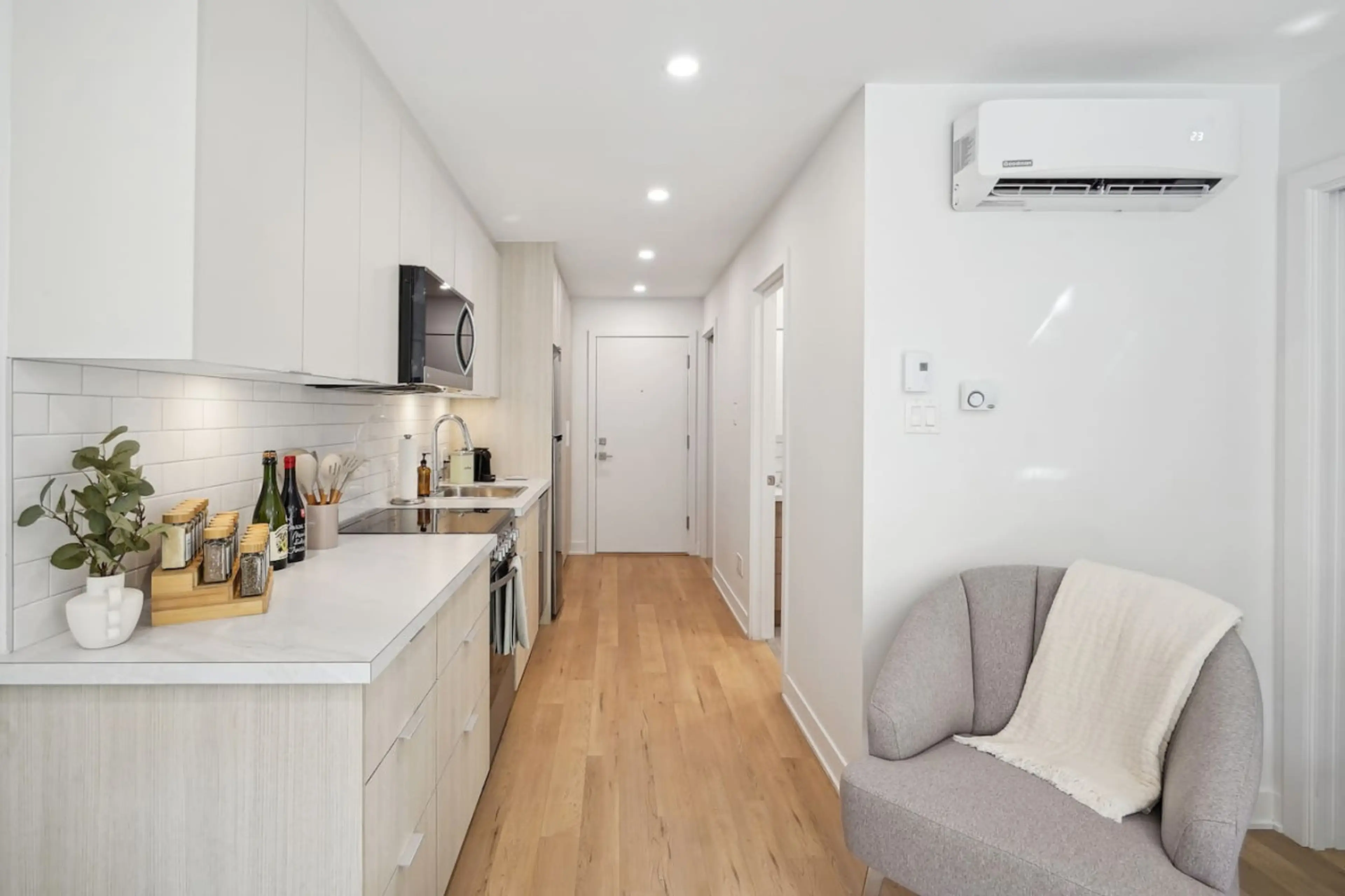 Modern kitchen just steps from the cozy couch — cook, connect, and unwind in one stylish space.