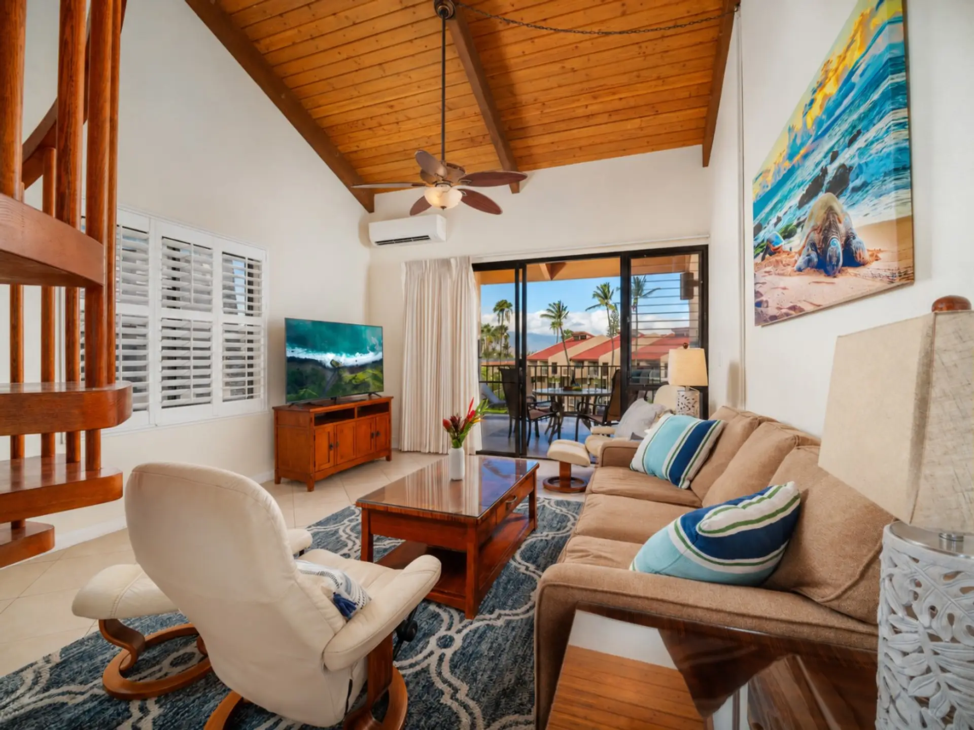 Spacious living area with queen sofa bed + TV with direct access to the lanai