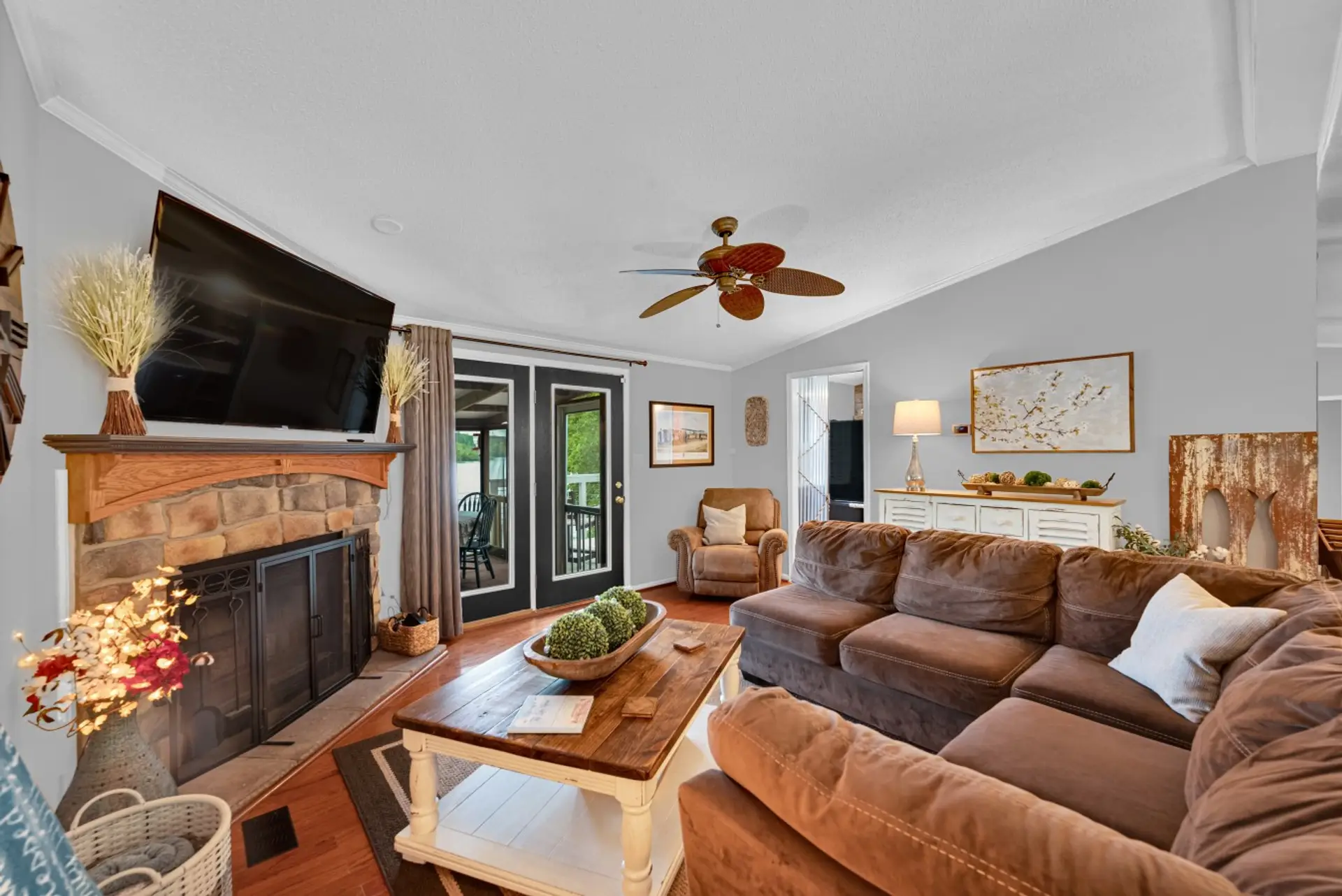 Living Room | Stone Fireplace | TV & Deck Access