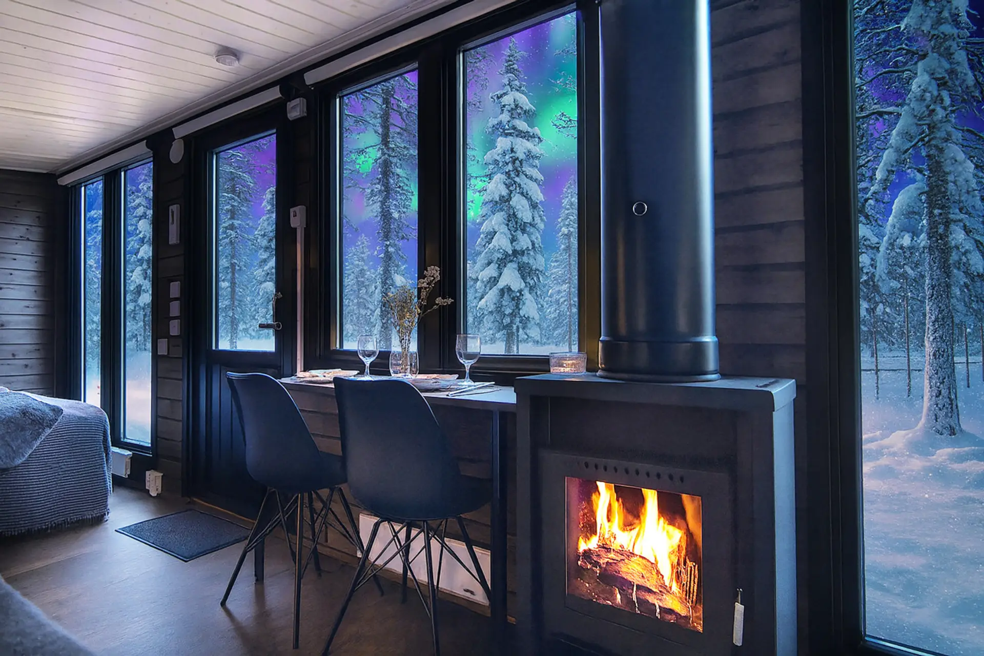 A cozy living area with fireplace and beautiful winter views.