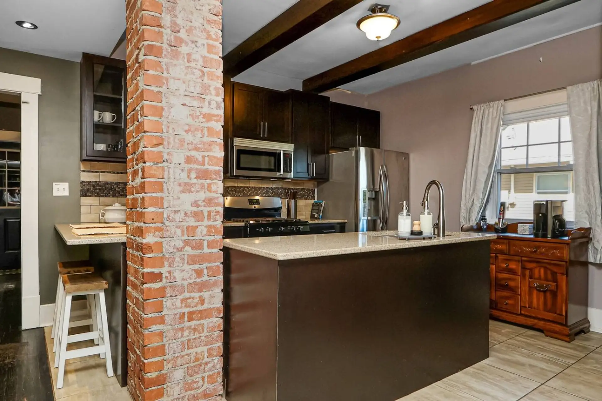 Fully stocked kitchen with a coffee bar
