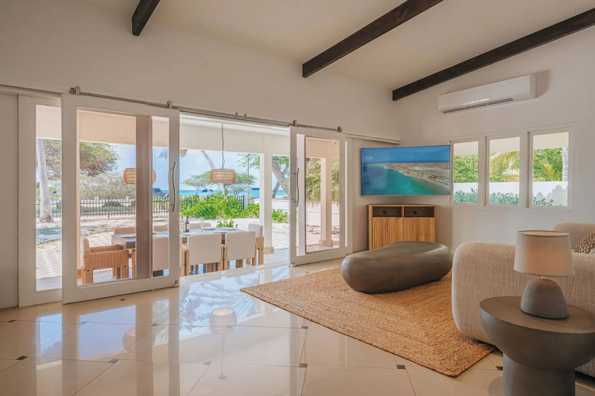 Indoor-outdoor luxury living: relax in the stylish space with seamless flow to your private Caribbean patio.