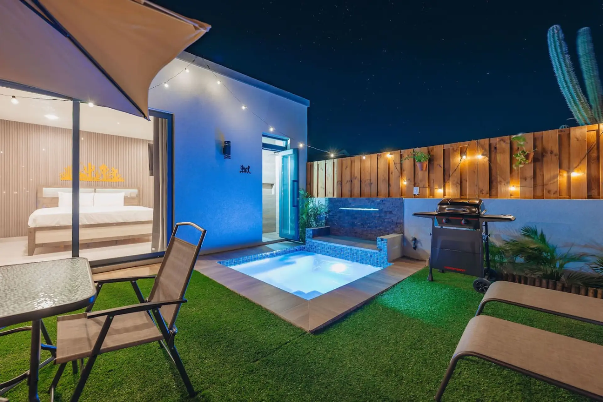 Luxury desert retreat with private hot tub, plunge pool & fire-lit patio under the stars 🌵✨ Modern oasis featuring outdoor lounge seating, BBQ grill, cozy king suite, and resort-style backyard perfect for romantic getaways or relaxing vacations.