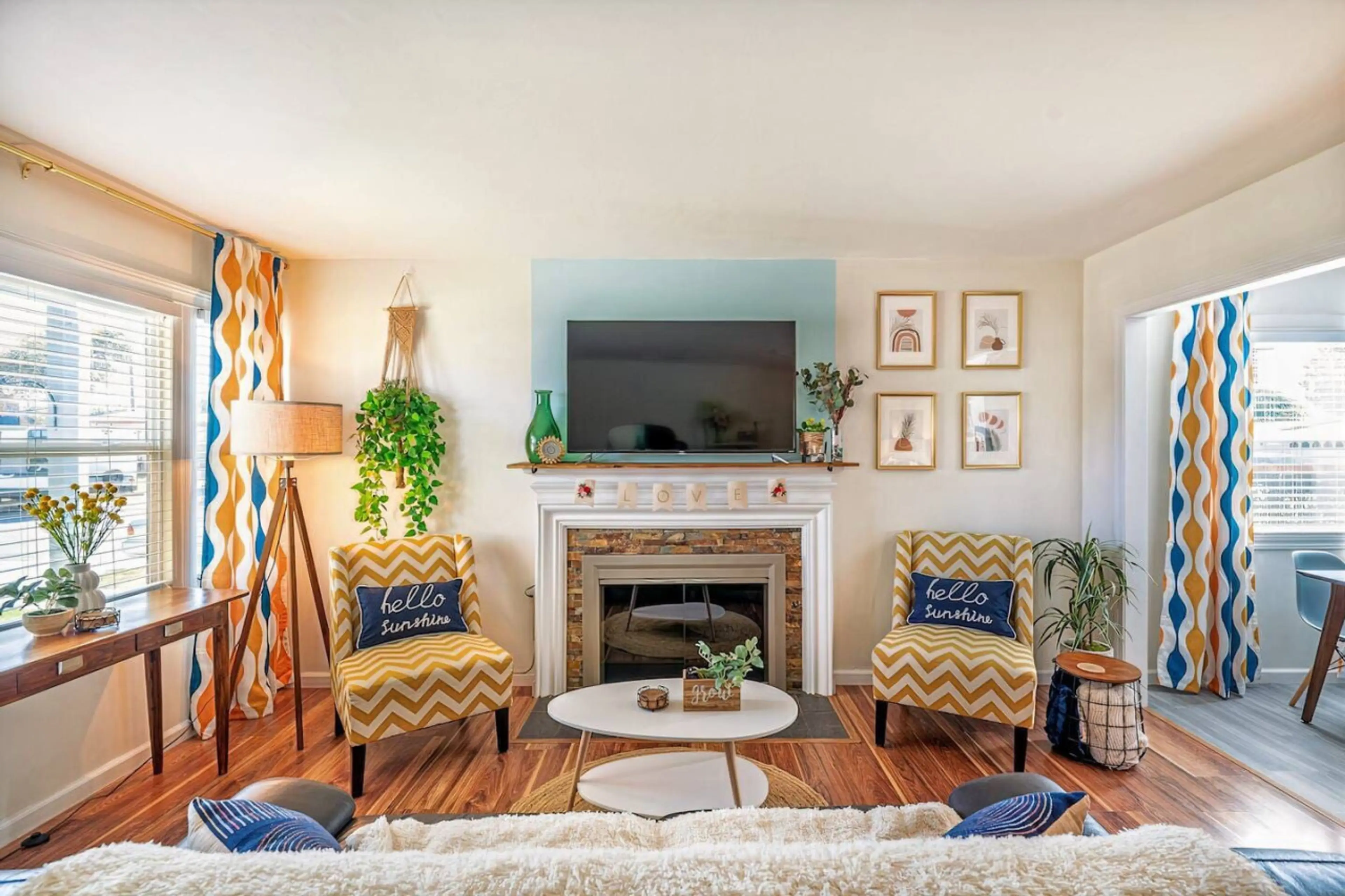 Step into Hello Sunshine's mid-century vibe in our cozy living room. Featuring a fully functional wood-burning fireplace (firewood not provided) and a 55" 4k Roku TV, our living room is another perfect setting for your family vacation nights in.