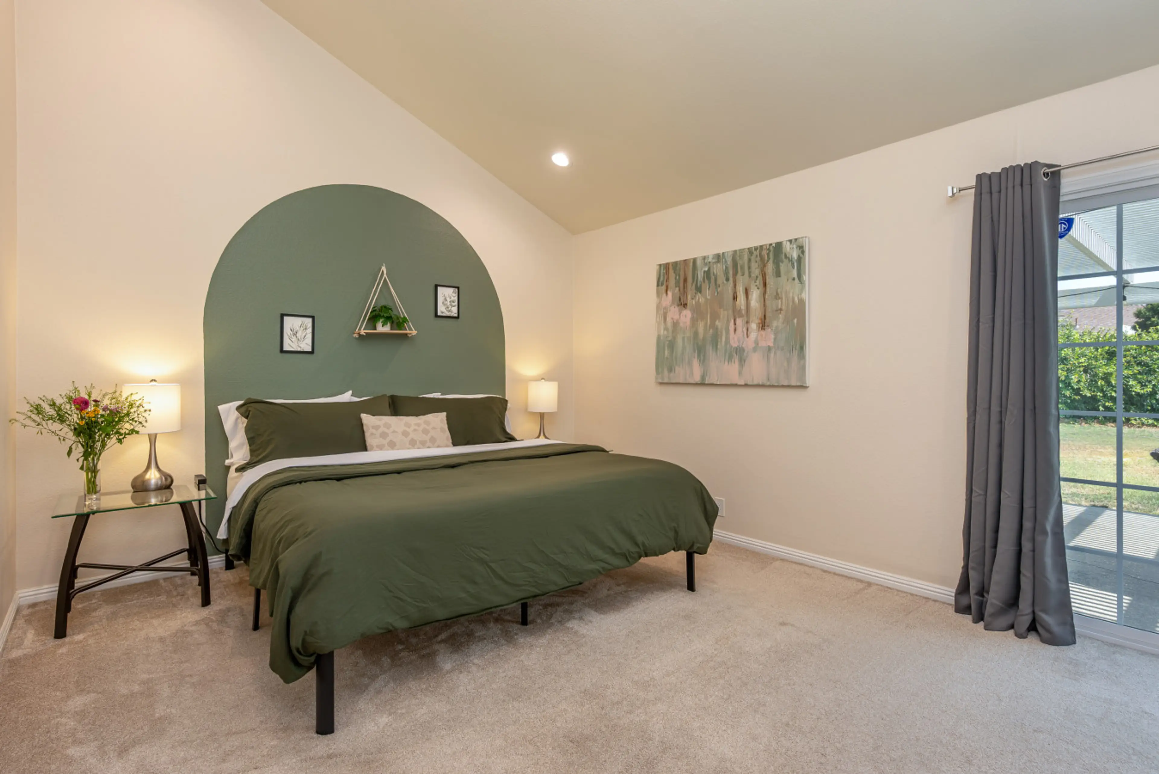 Wake up to garden views and gentle light—this tranquil bedroom is your personal retreat.