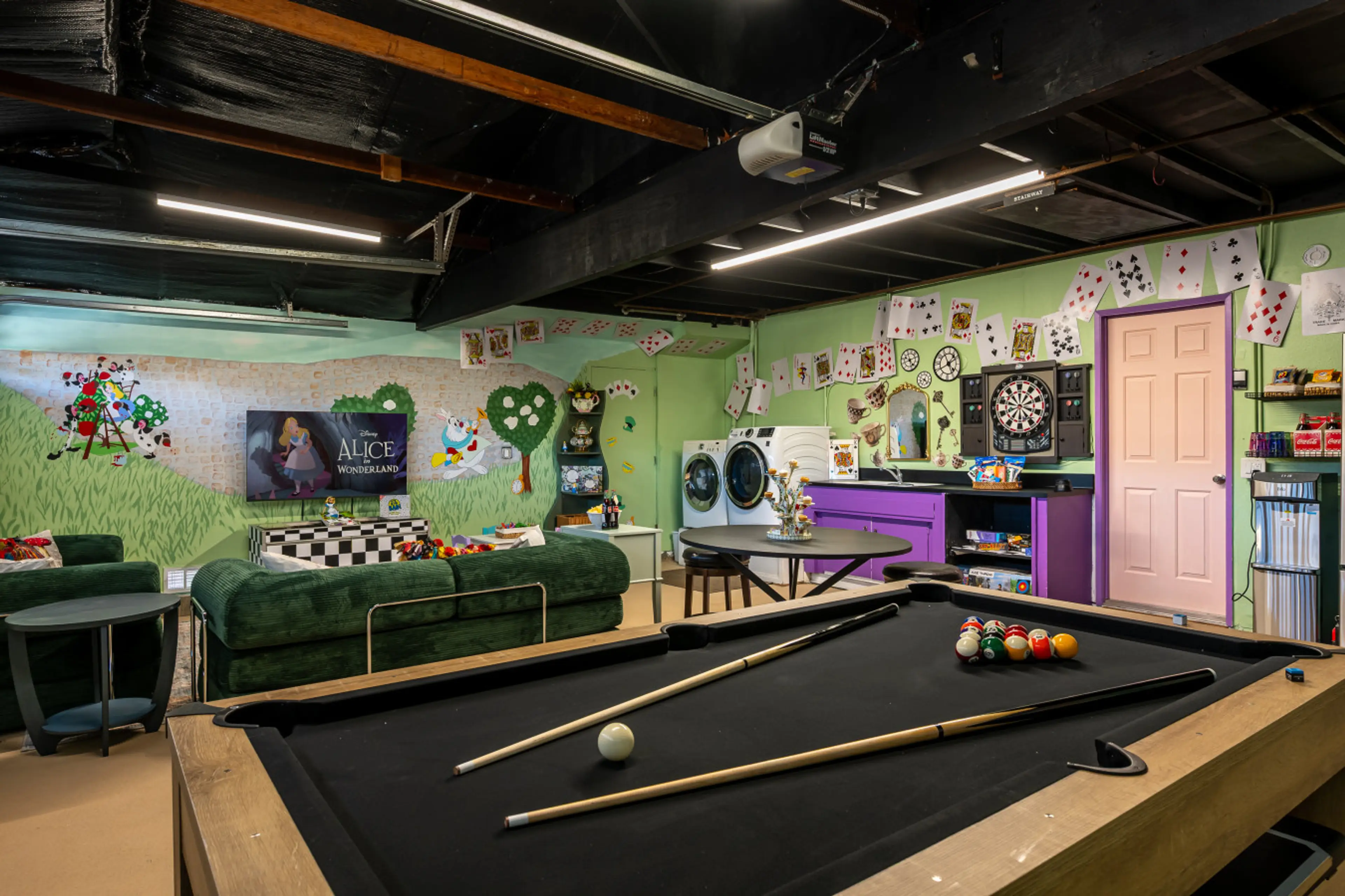Step into Wonderland. This game room features a combo pool and ping-pong table, comfy seating, a Smart TV, and plenty of space to play and unwind.