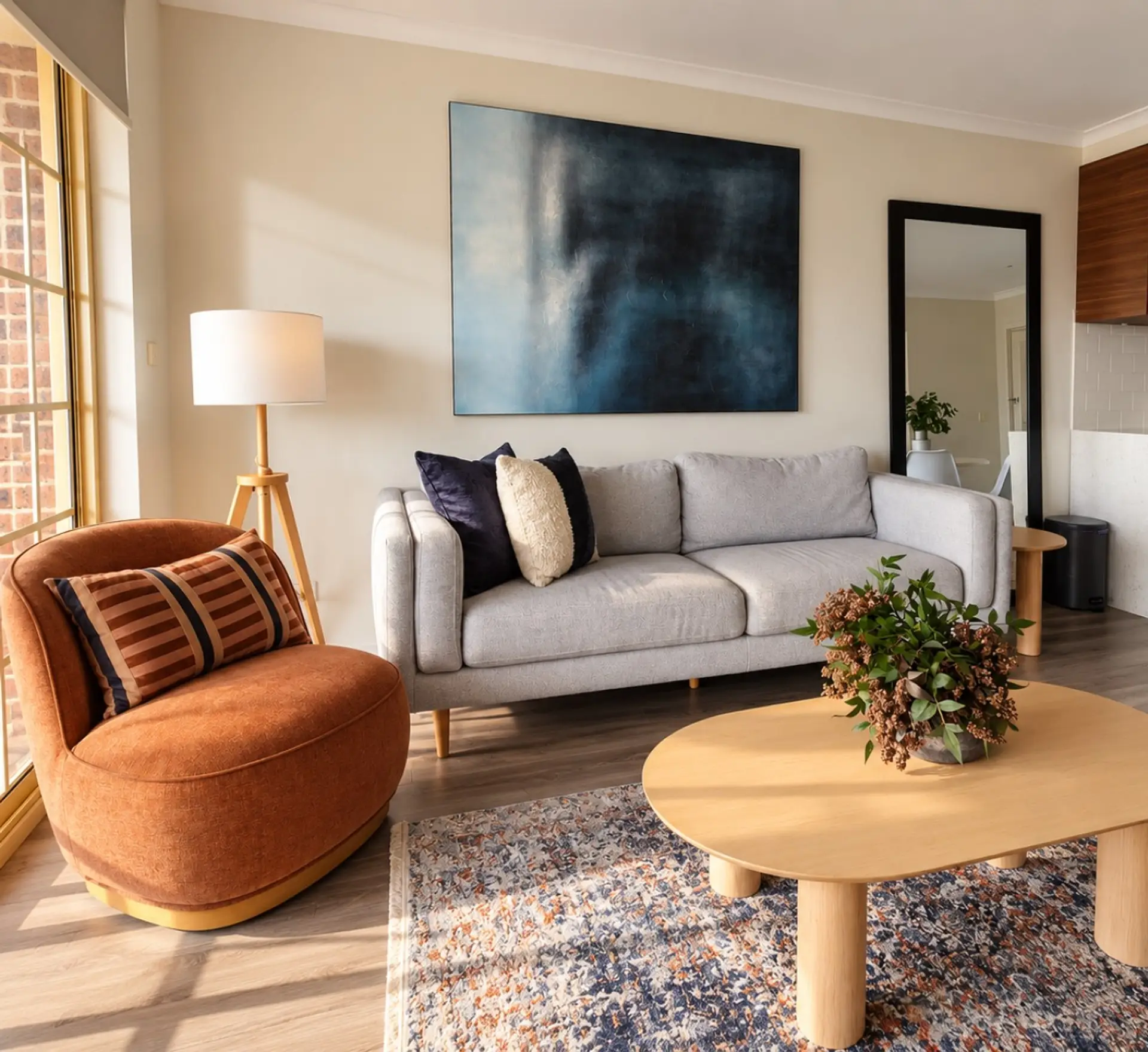 Relax in the comfortable living room, where a plush sofa, stylish armchair and soft rug create a warm space to put your feet up. It’s perfect for enjoying a quiet morning coffee or settling in for a cosy evening.