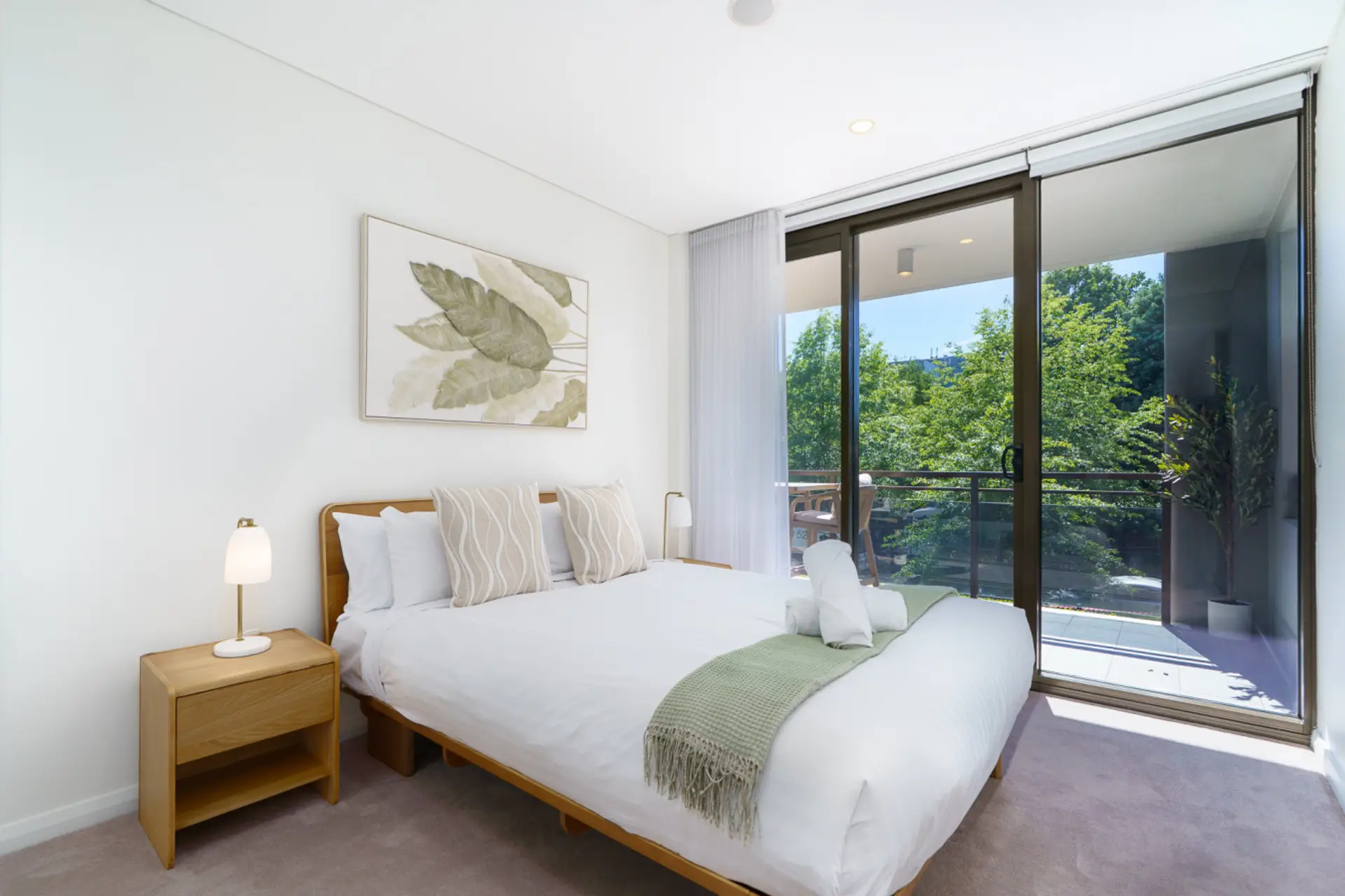 Rest easy in this peaceful, light-filled bedroom designed for comfort and calm