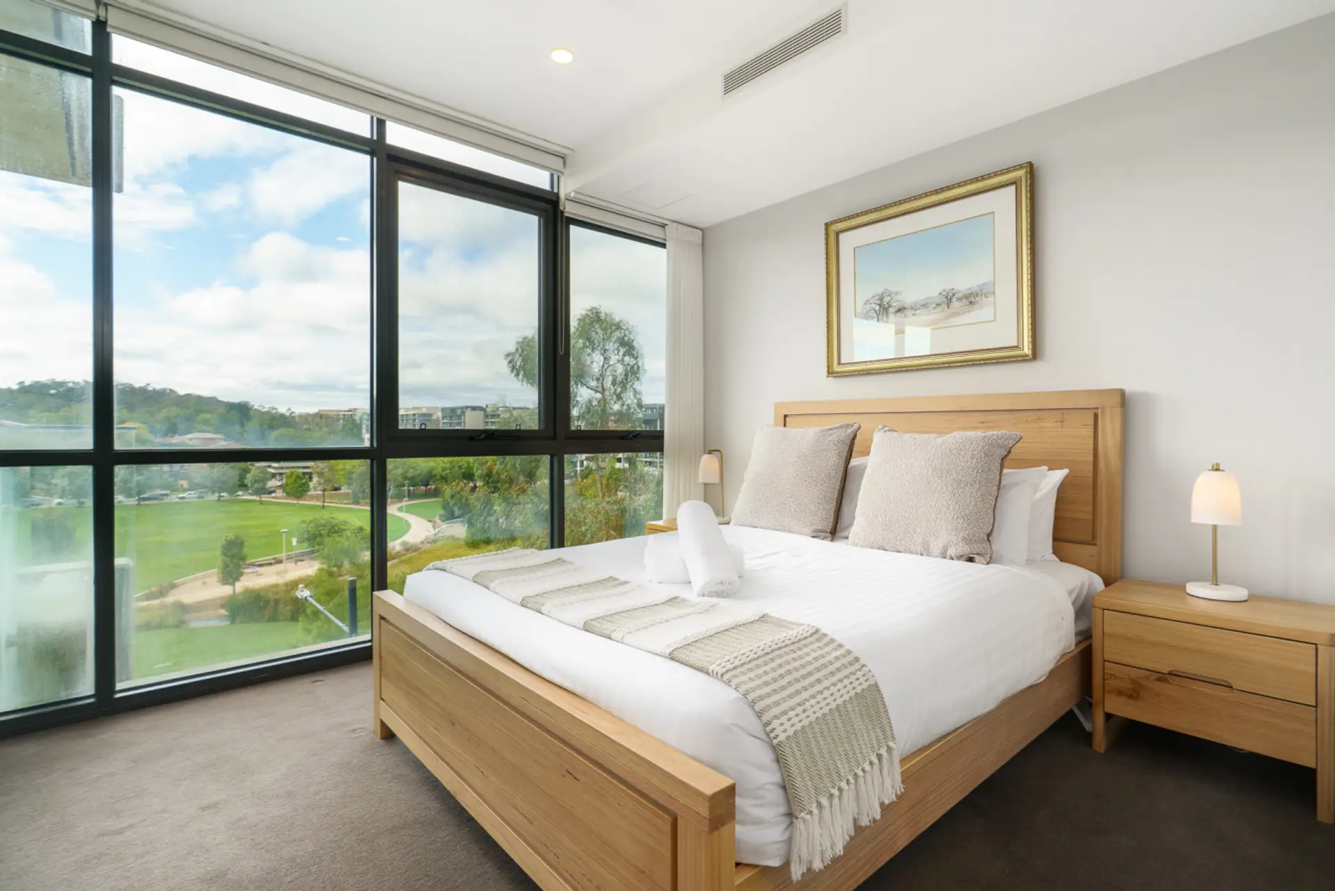 Wake up to serene views from this comfy bedroom, filled with natural light and cosy vibes.