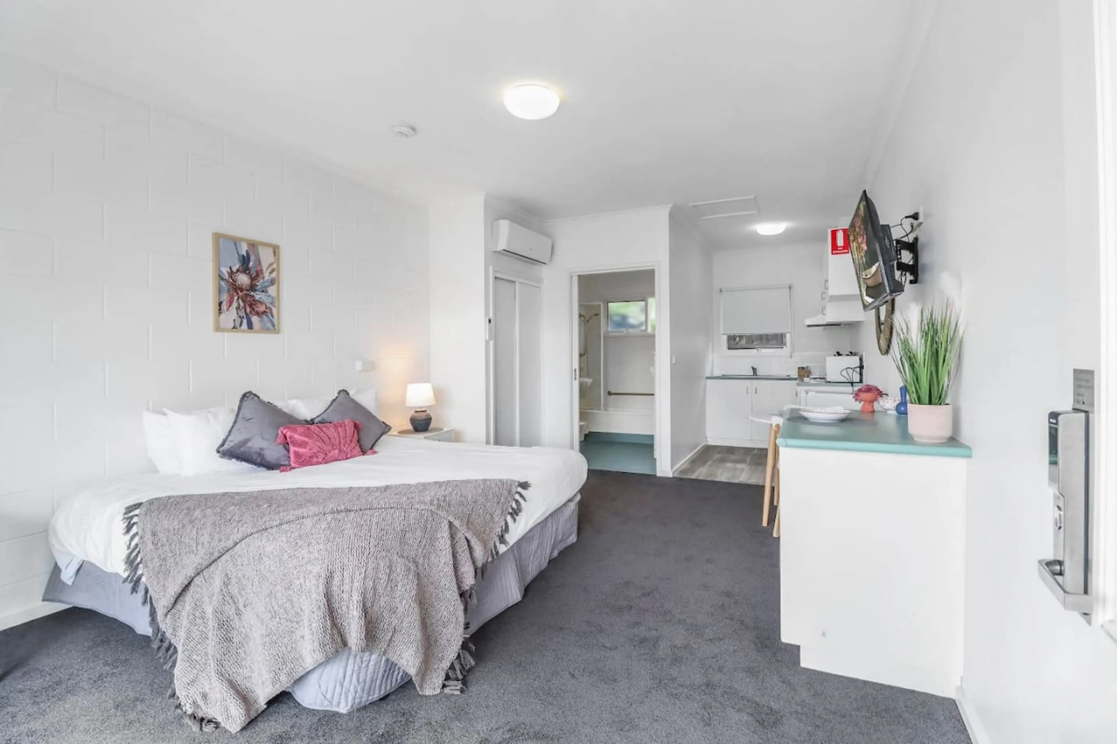 Large open-plan studio with private entrance, dining area, and individually controlled climate systems.