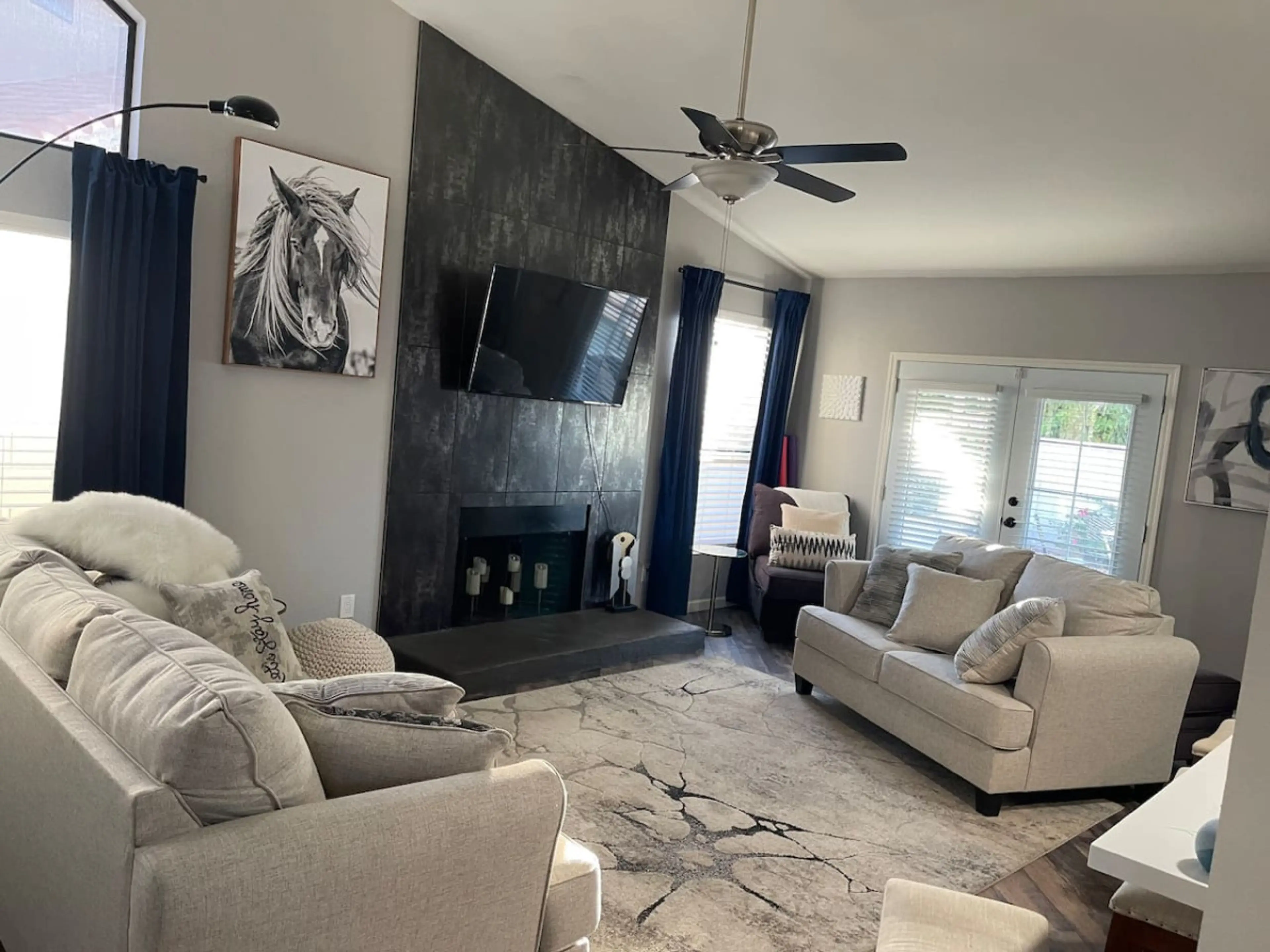 Comfortable living room with patio access and a smart TV for easy streaming