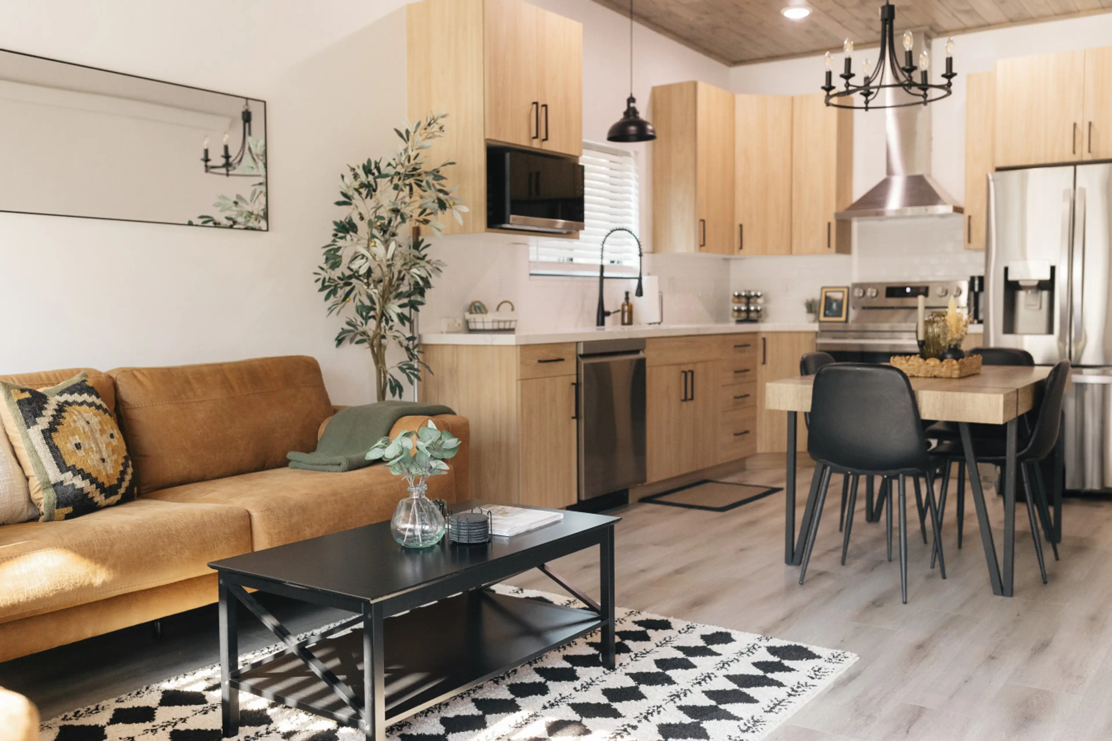 Living room with two large couches next to the kitchen.