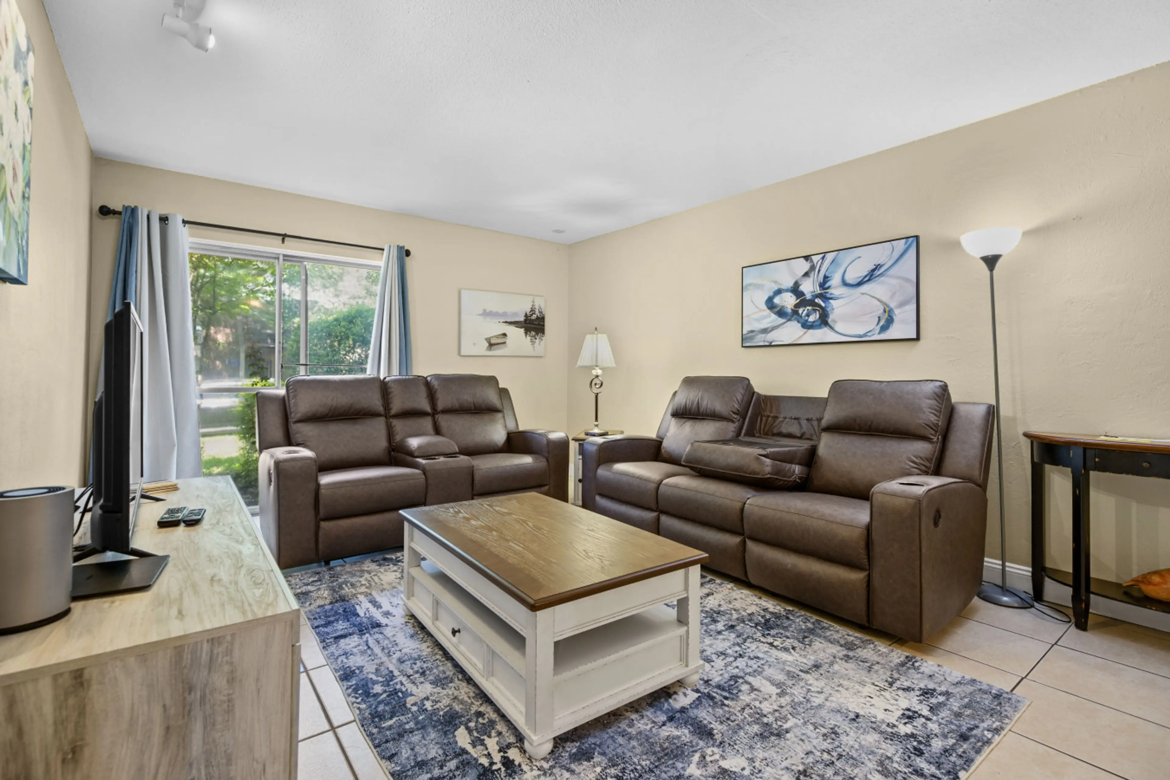 Comfortable living room with reclining couches- perfect for relaxing after a long day