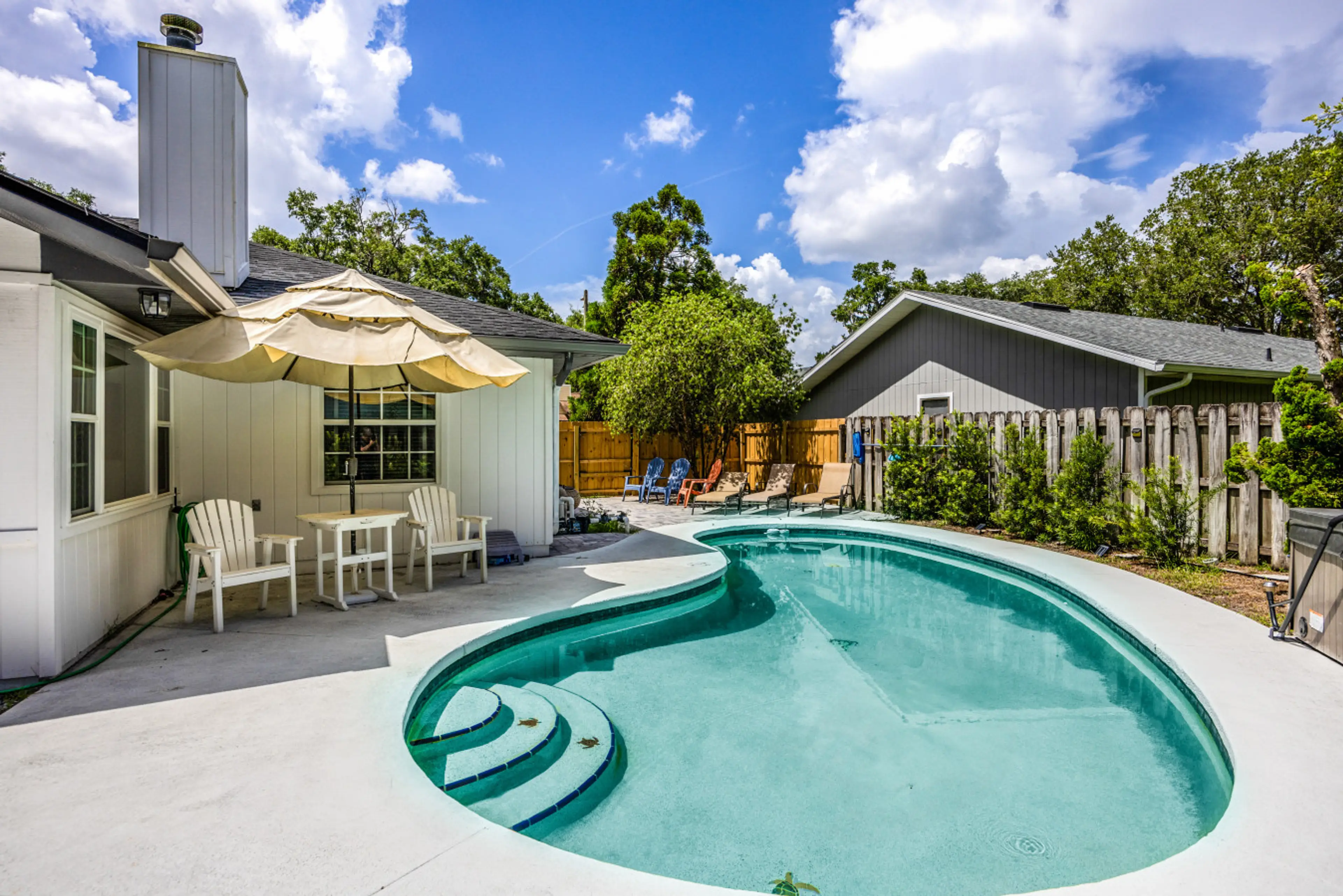 Beautiful and Spacious Backyard with Pool, Hot Tub, Outdoor TV and Plenty of Sitting Areas