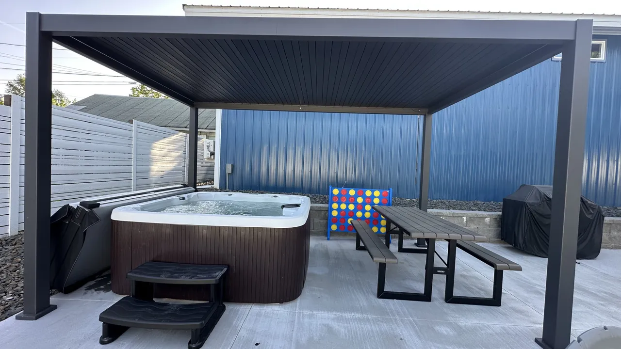 Backyard retreat with hot tub, picnic table, and giant Connect Four