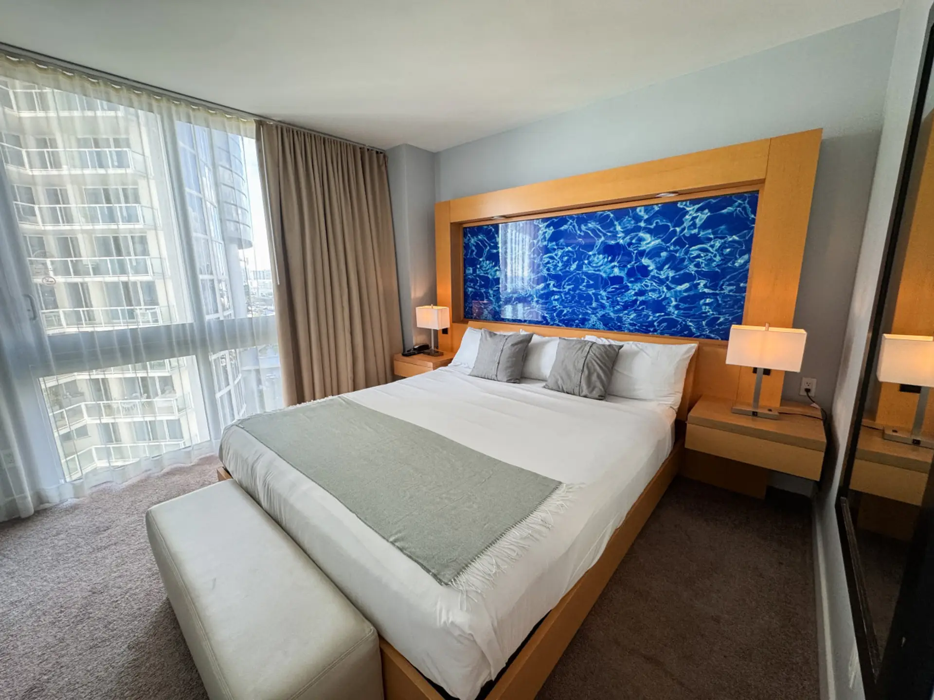 Spacious bedroom with large bed and plenty of natural light.