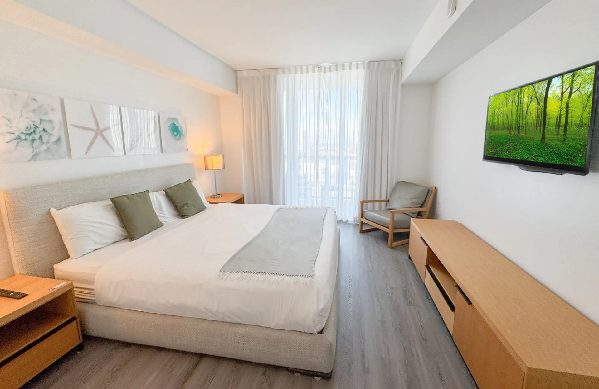 Bright and welcoming bedroom with a king bed and contemporary decor.