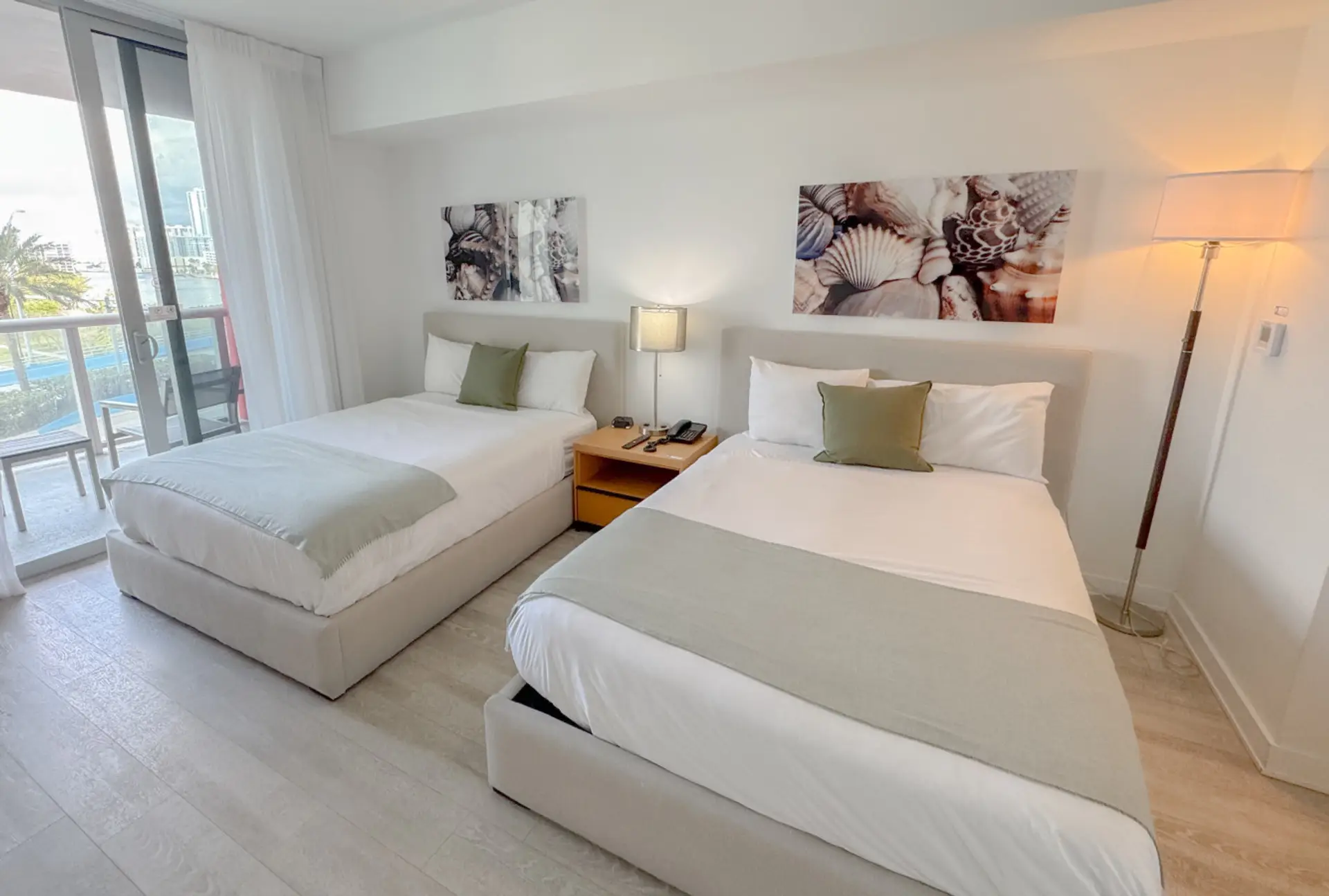 Spacious bedroom with balcony access and Smart TV.