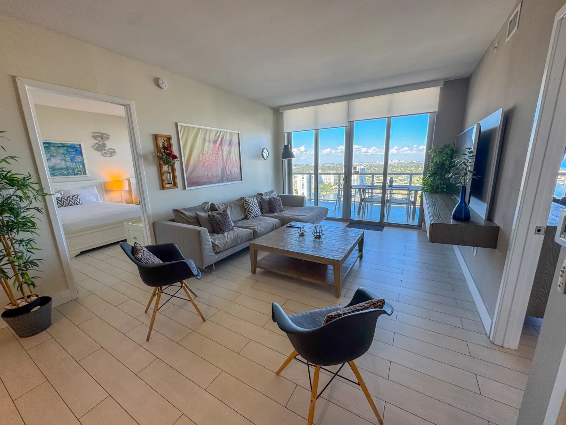Bright living room with a stylish accent wall and comfortable seating for relaxing moments.