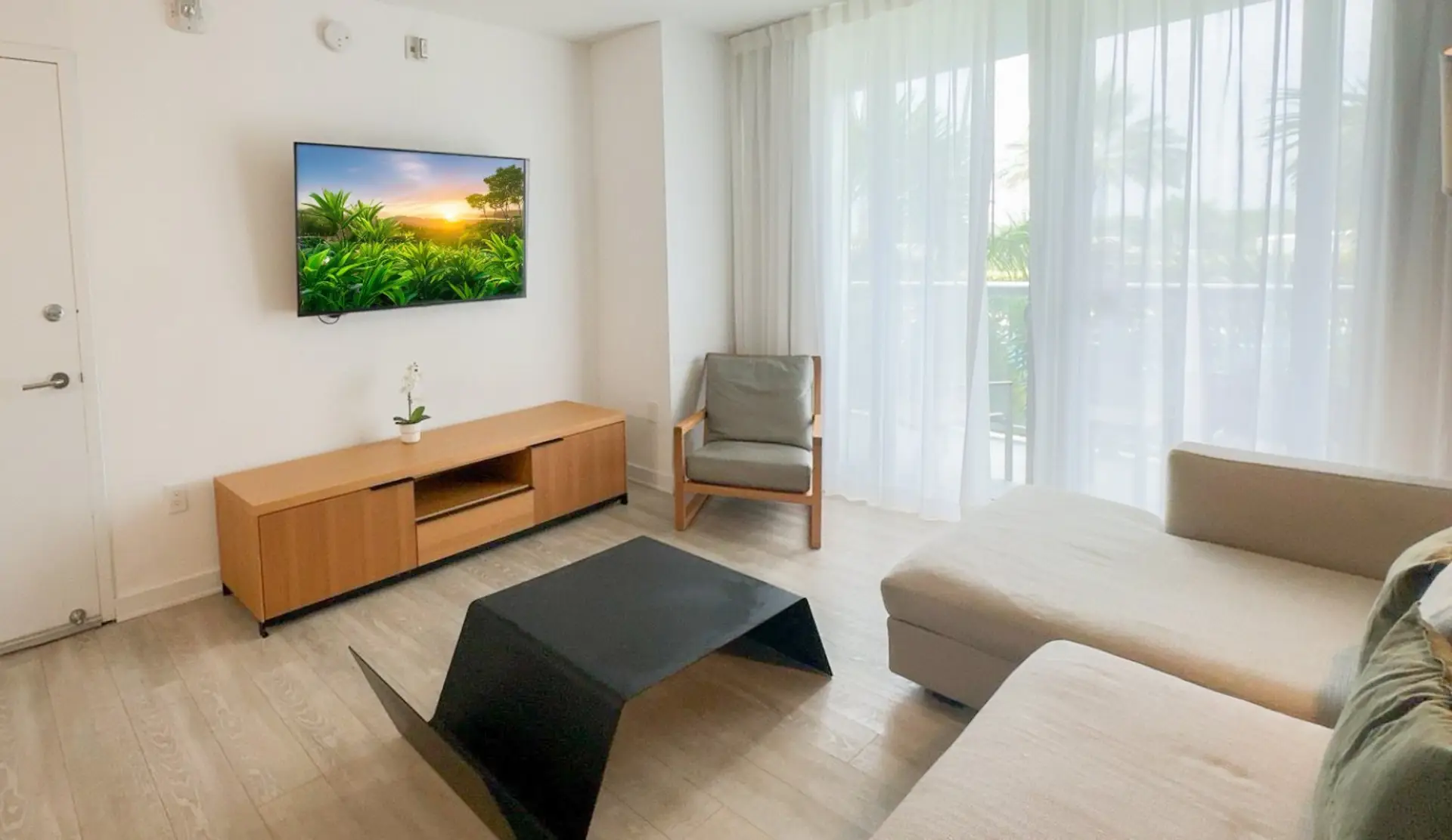 Bright living room with a stylish accent wall and comfortable seating for relaxing moments.