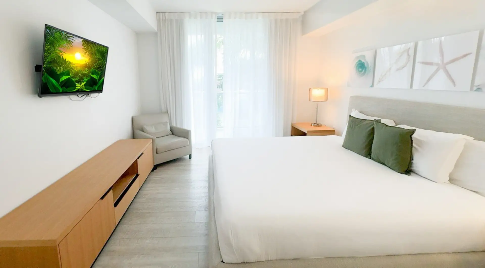 Spacious bedroom with a king-size bed and blackout curtains, perfect for restful nights.