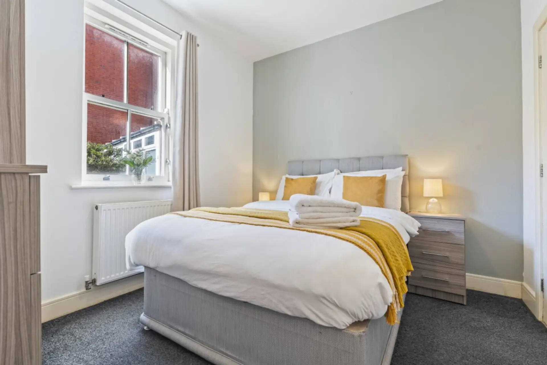A comfortable double bed with fresh linens, offering a cosy and relaxing space for a restful night’s sleep. (Rich Property Management)