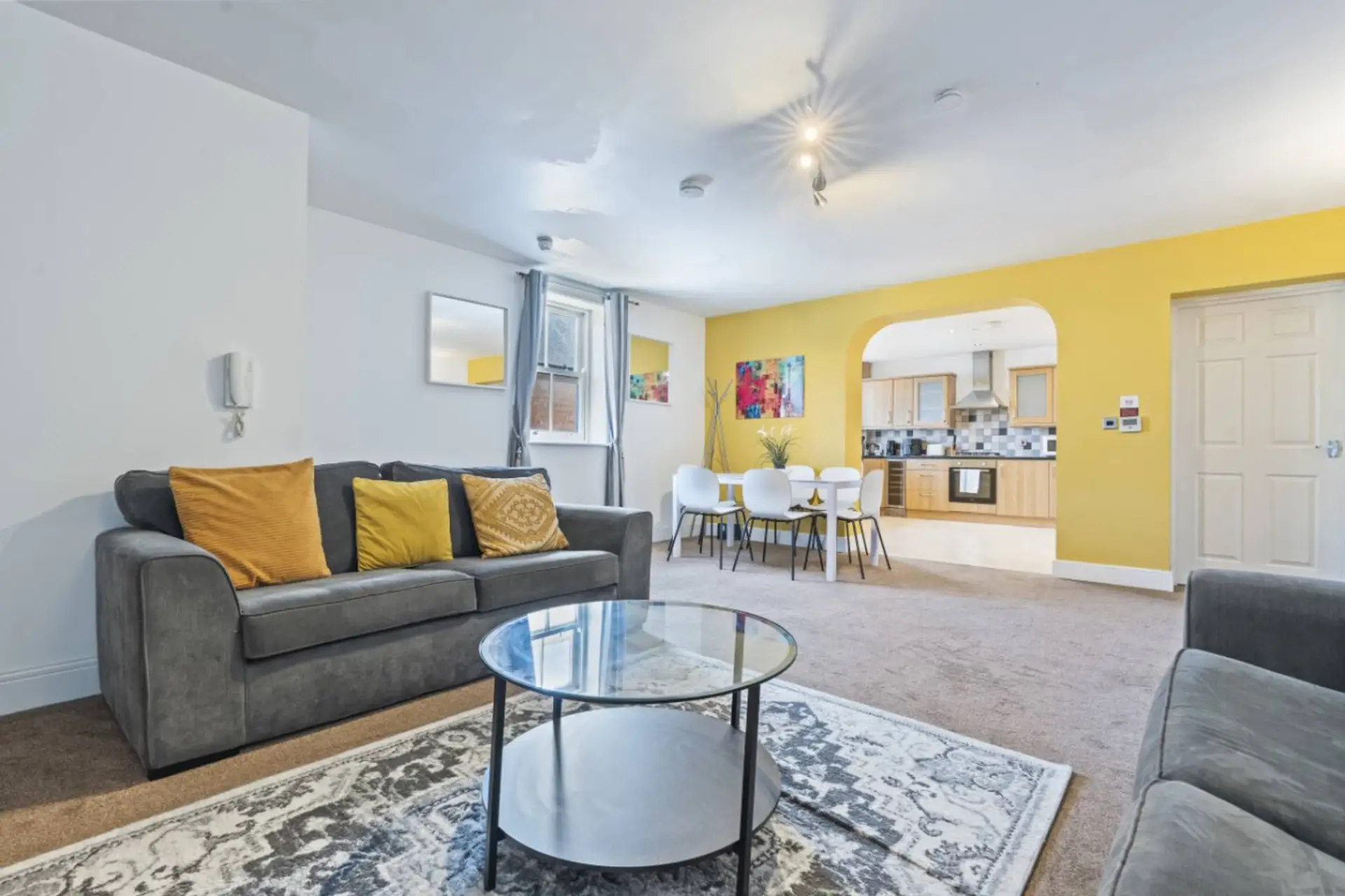 A bright and welcoming living room with a dining area conveniently positioned alongside it, perfect for relaxing, socialising, and enjoying meals together. (Rich Property Management)