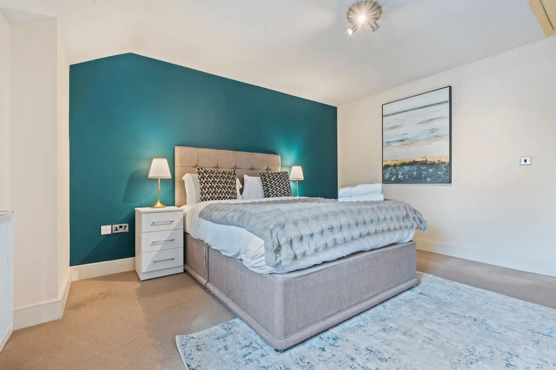 A comfortable double bed with fresh linens, offering a cosy and relaxing space for a restful night’s sleep. (Rich Property Management)
